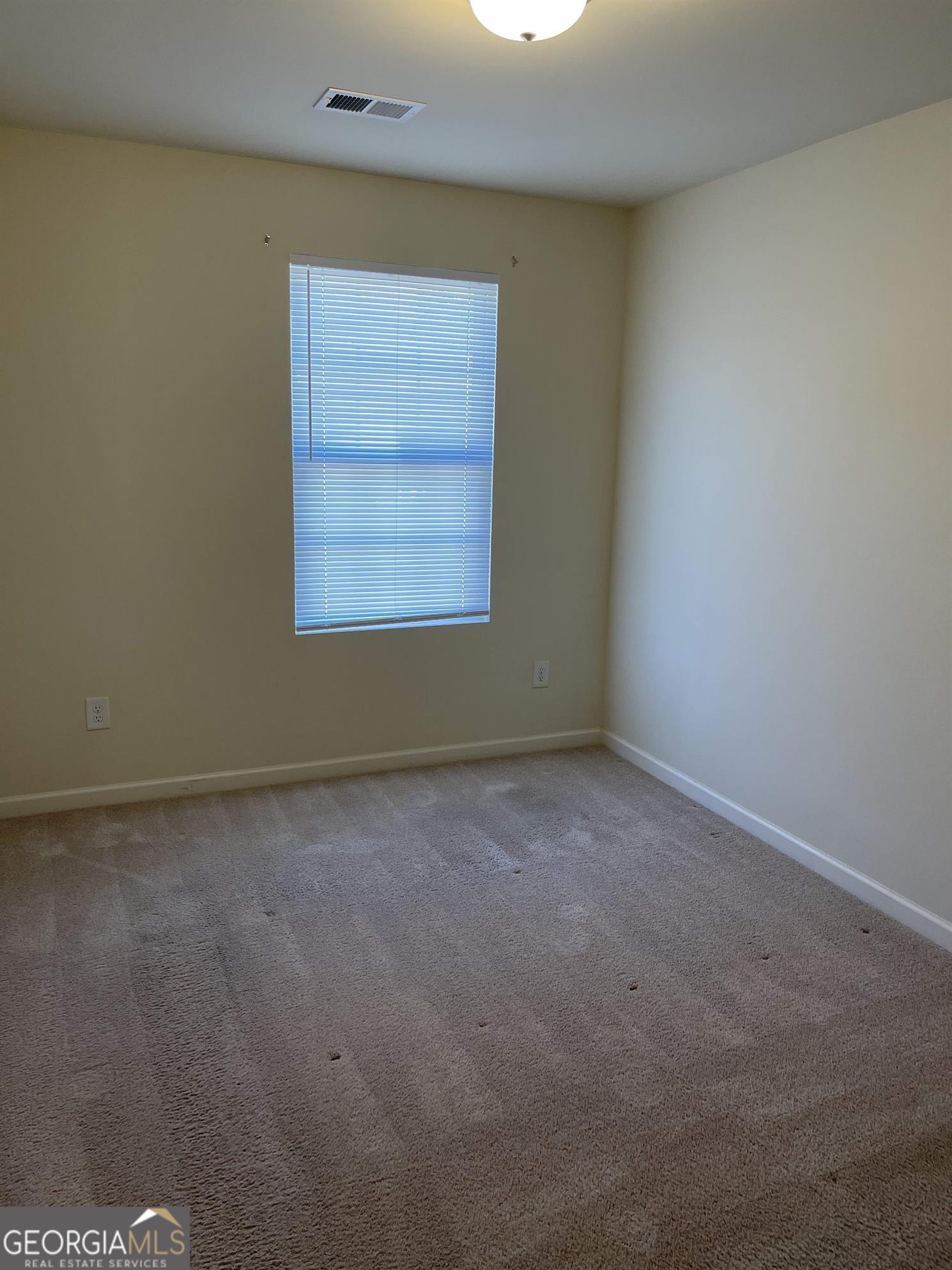 408 Erin Court Villa Rica, GA 30180 - Photo 12 of 16 an empty room with a window