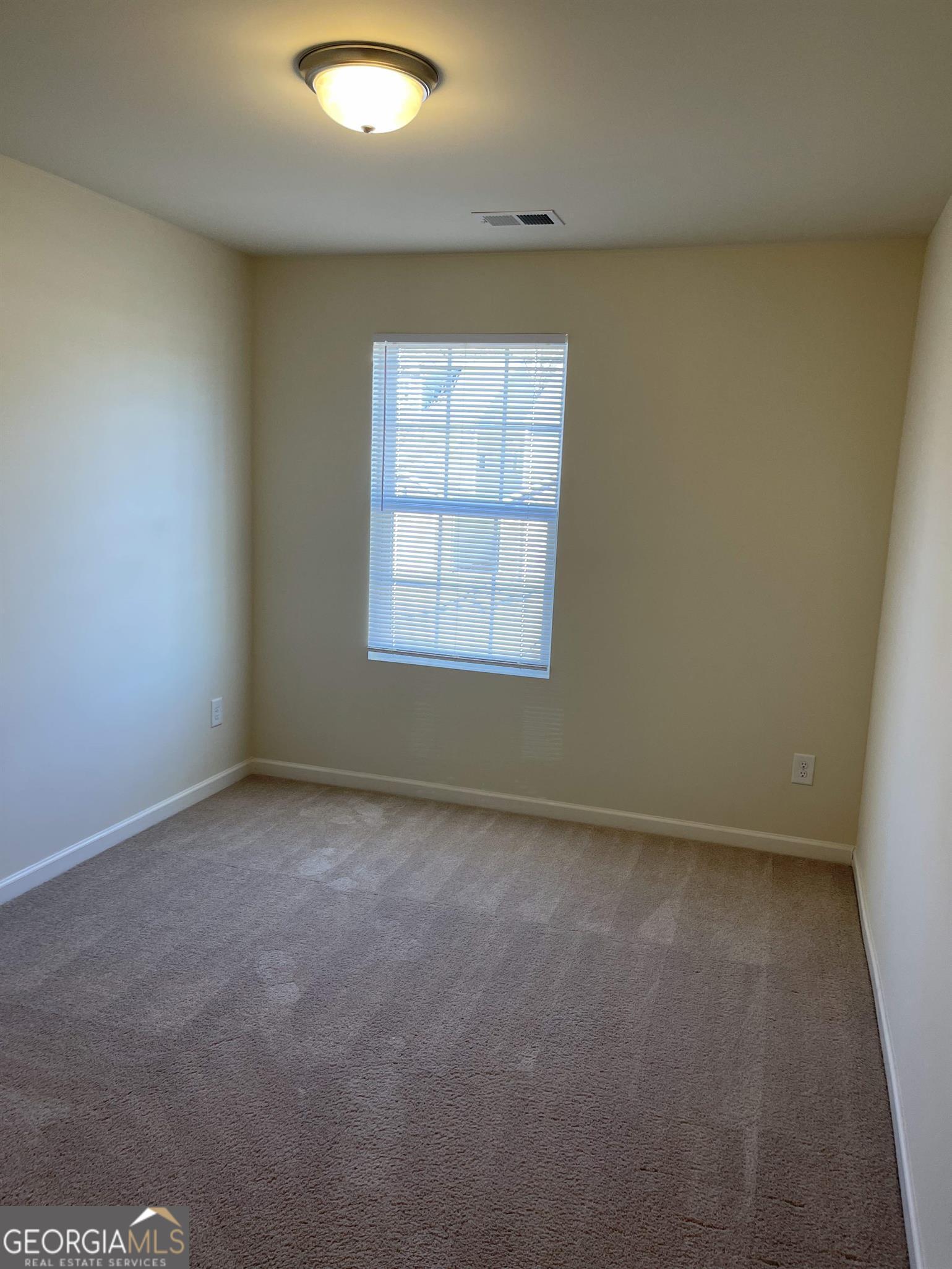 408 Erin Court Villa Rica, GA 30180 - Photo 13 of 16 an empty room with a window