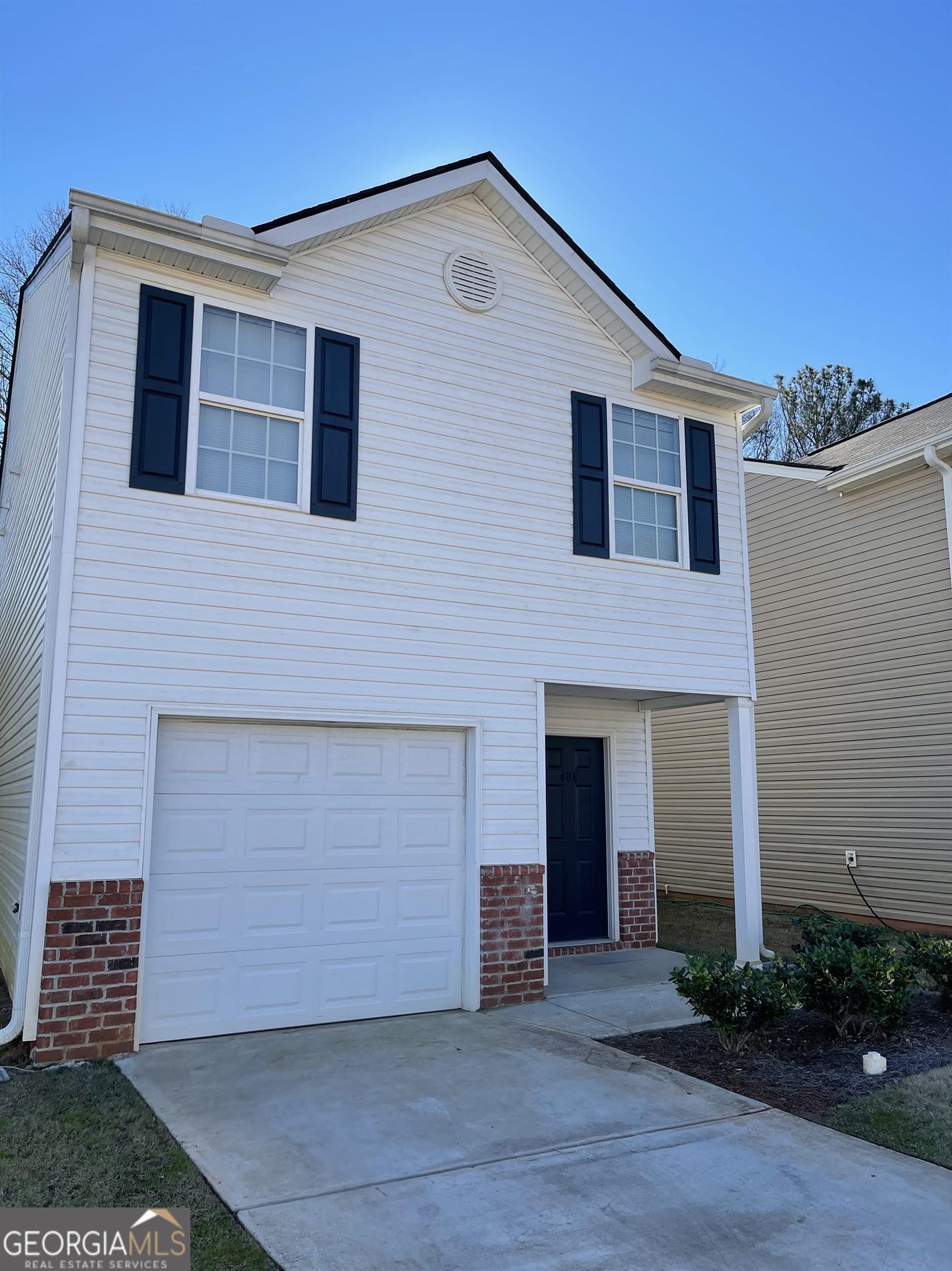 408 Erin Court Villa Rica, GA 30180 - Photo 2 of 16 a front view of a house with plants and garage