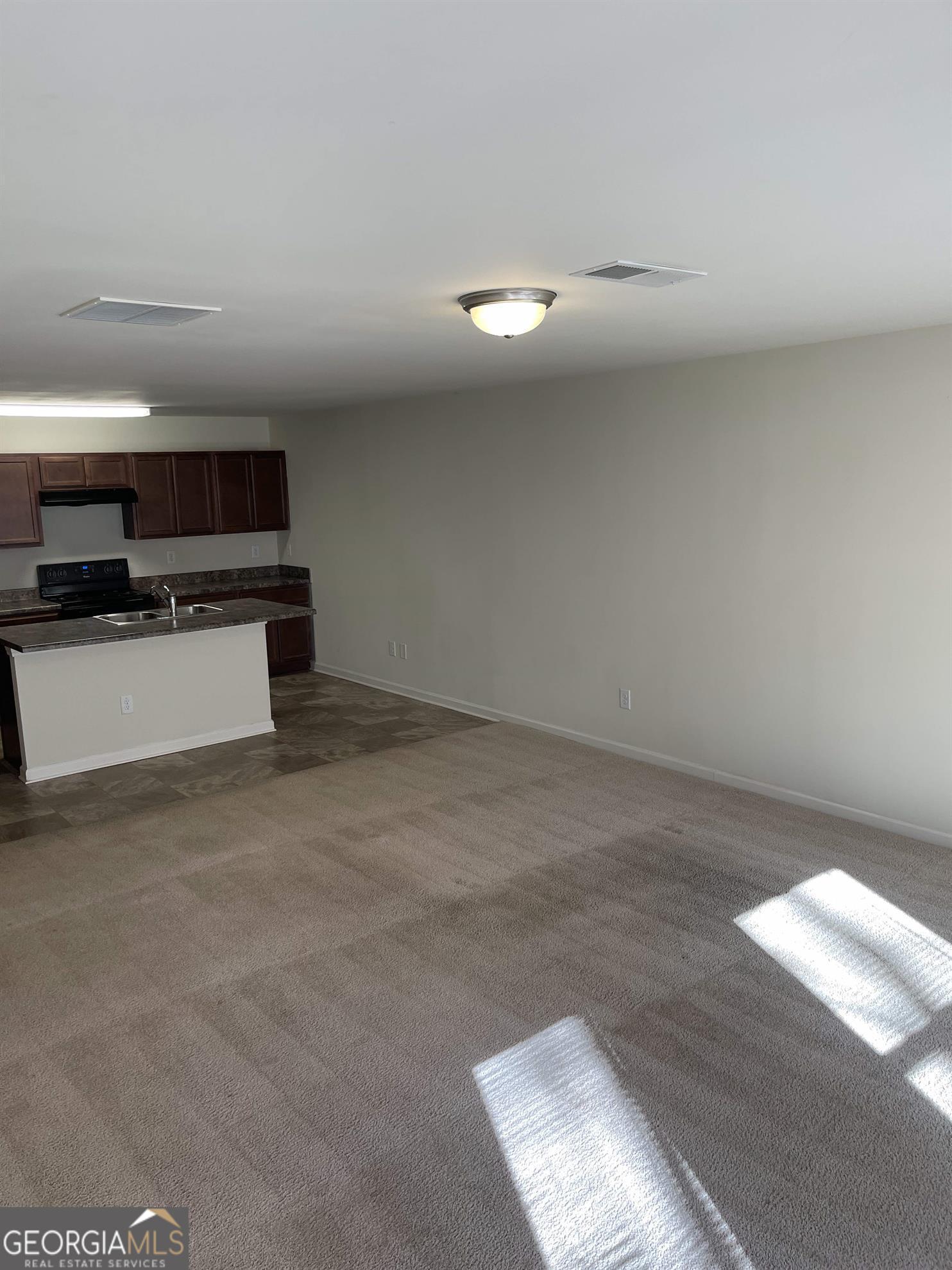 408 Erin Court Villa Rica, GA 30180 - Photo 4 of 16 a view of kitchen and microwave