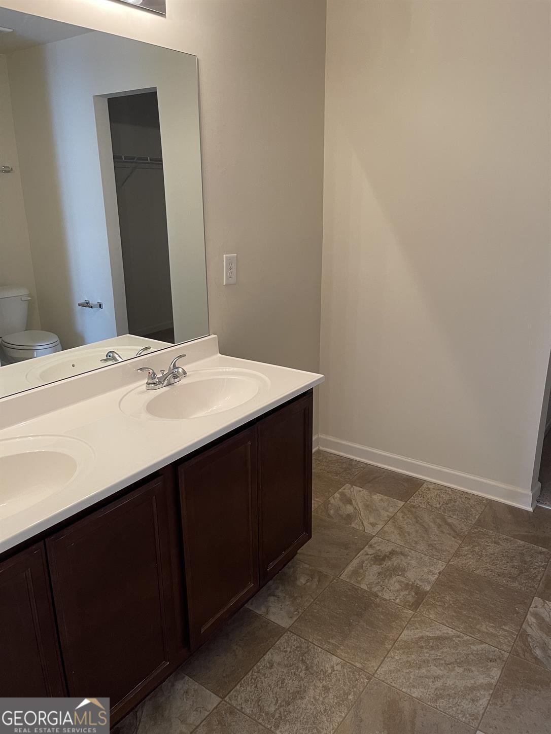 408 Erin Court Villa Rica, GA 30180 - Photo 5 of 16 a bathroom with a sink vanity and a mirror