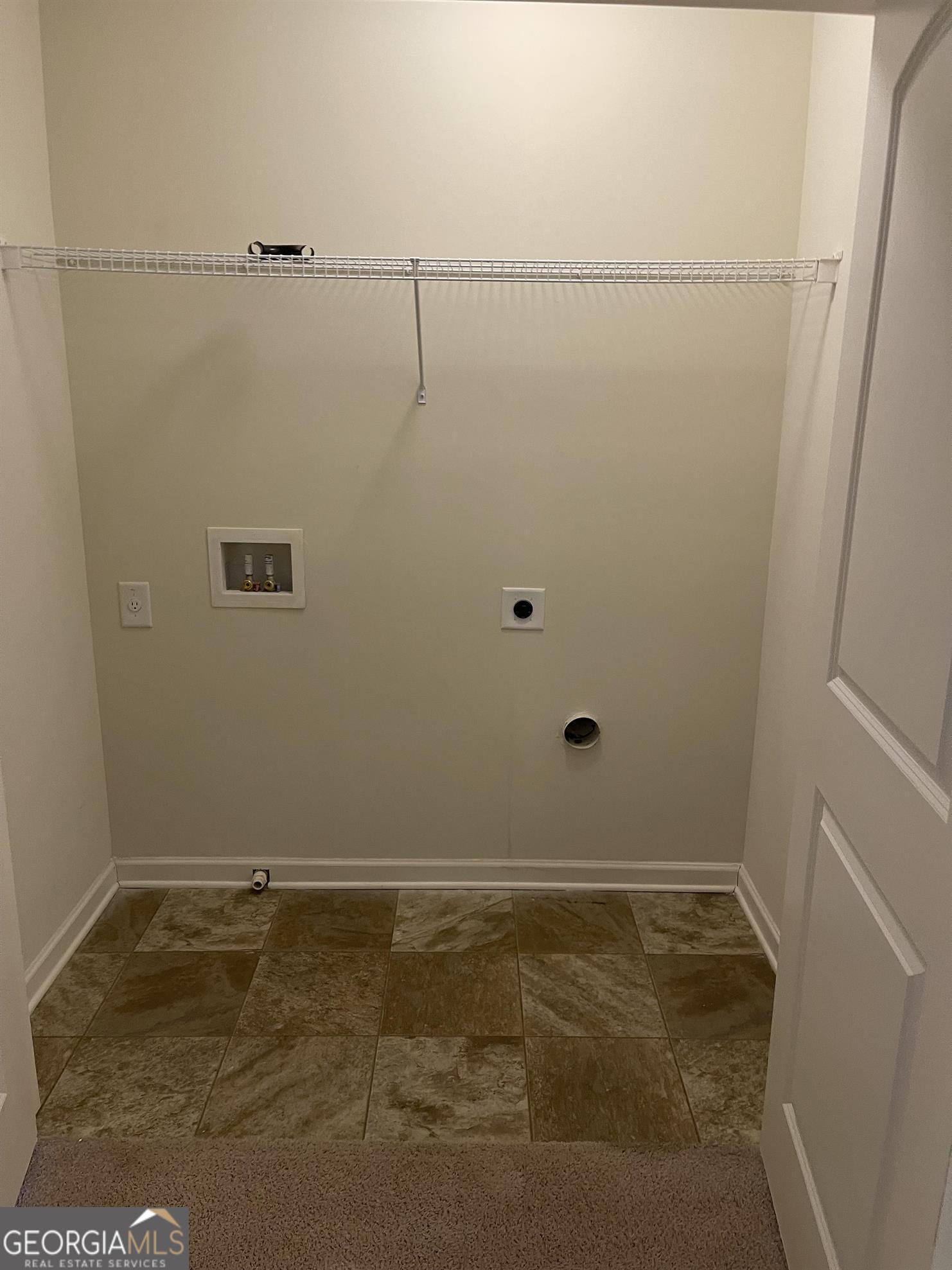 408 Erin Court Villa Rica, GA 30180 - Photo 9 of 16 a view of a room with racks on the wall