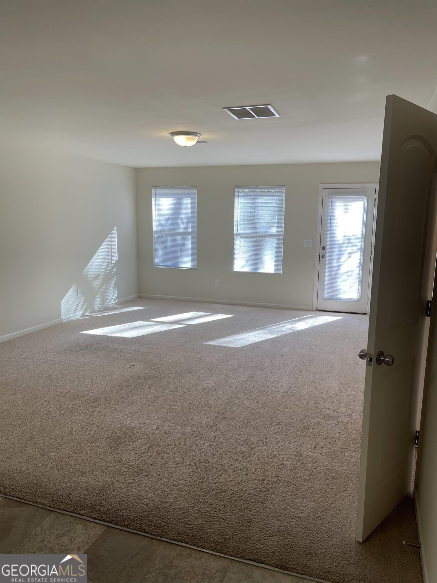408 Erin Court Villa Rica, GA 30180 - Photo 10 of 16 a view of a room with window and refrigerator