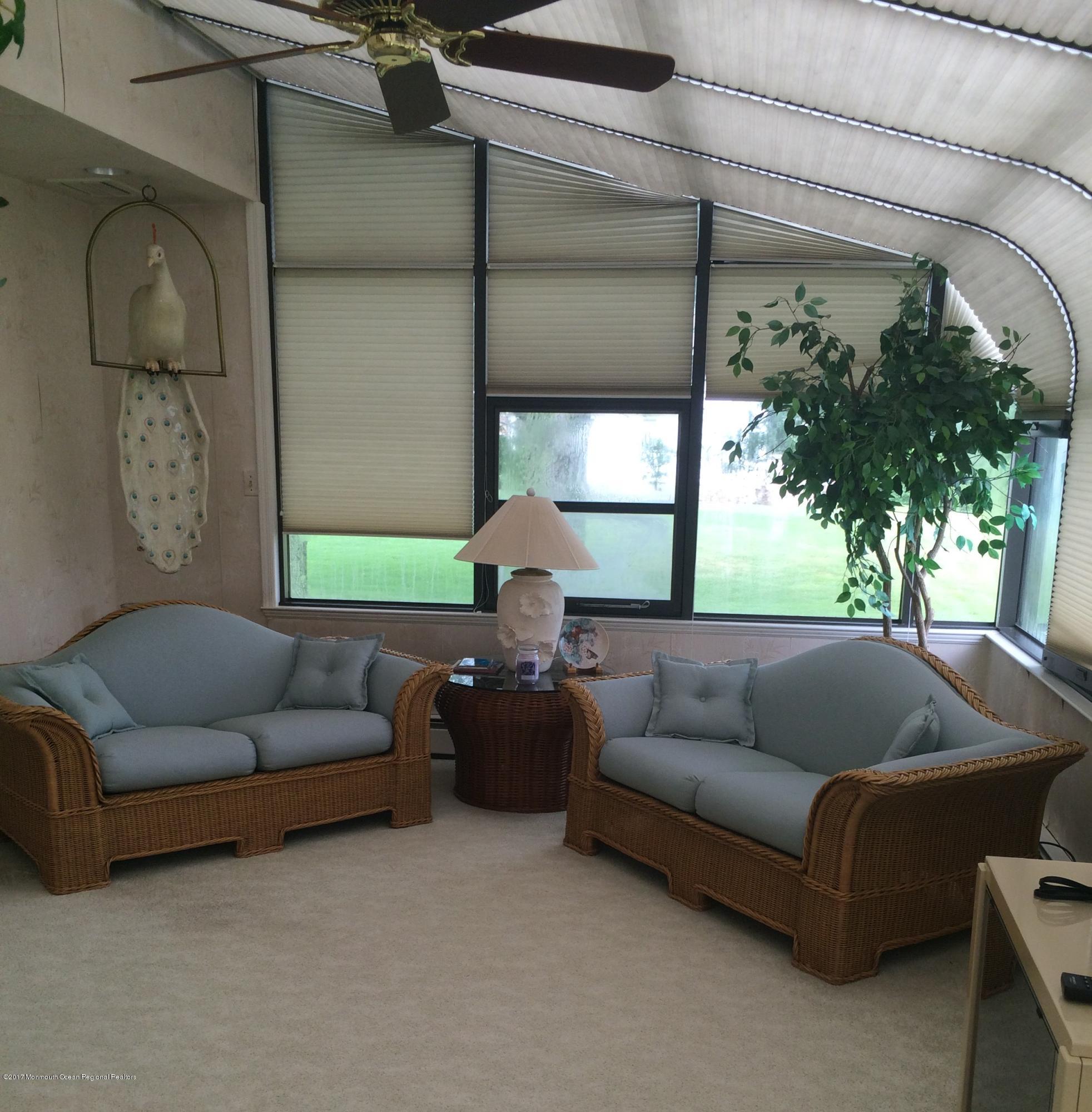 176 Stone Hill Road Colts Neck, NJ 07722 - Photo 13 of 26 a living room with furniture and a window
