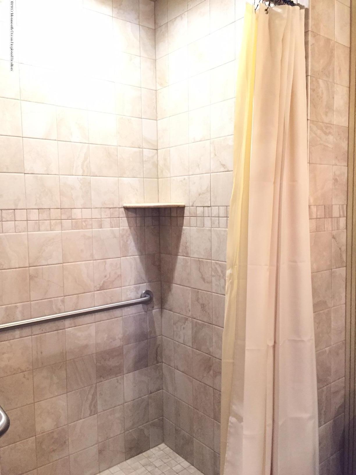 176 Stone Hill Road Colts Neck, NJ 07722 - Photo 14 of 26 a bathroom with a shower