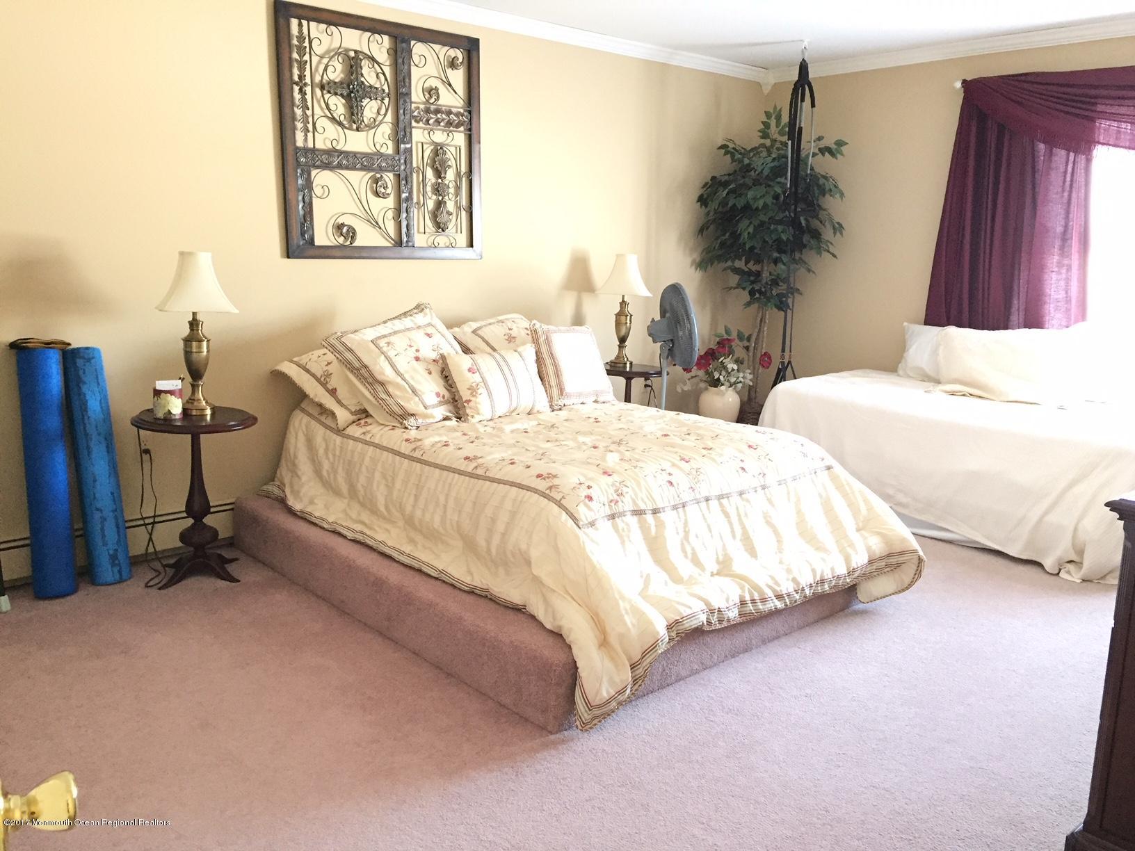 176 Stone Hill Road Colts Neck, NJ 07722 - Photo 23 of 26 a bedroom with bed and a window