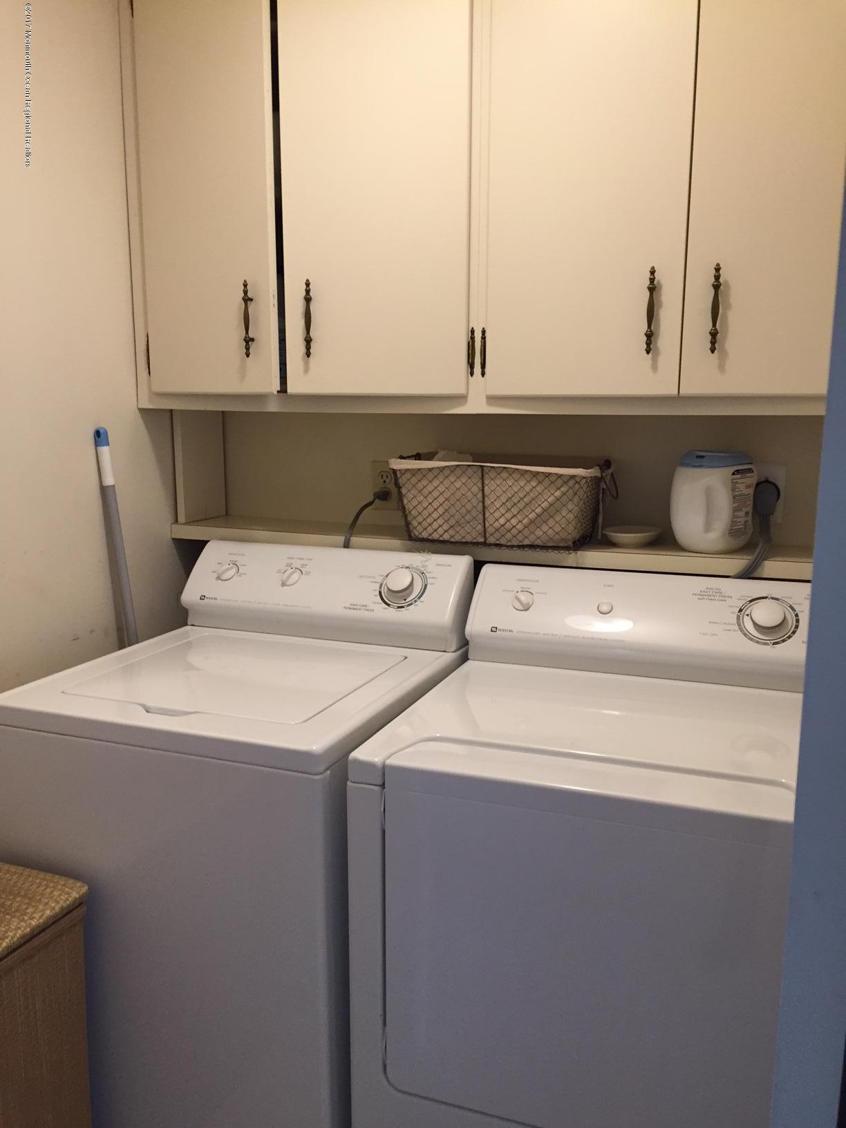 176 Stone Hill Road Colts Neck, NJ 07722 - Photo 25 of 26 a utility room with washer and dryer