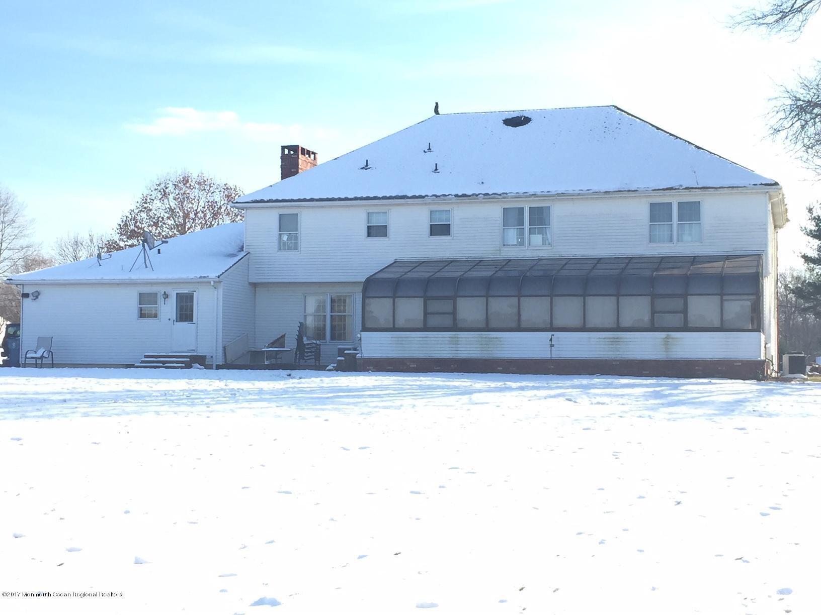 176 Stone Hill Road Colts Neck, NJ 07722 - Photo 26 of 26 a front view of a house with a yard
