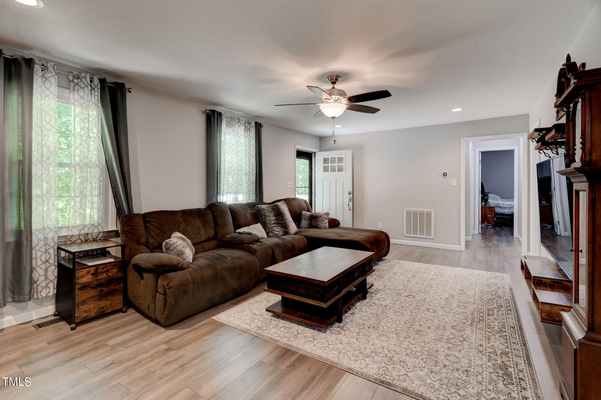 3408 High Gate Road Raleigh, NC 27603 - Photo 14 of 49 a living room with furniture and a flat screen tv