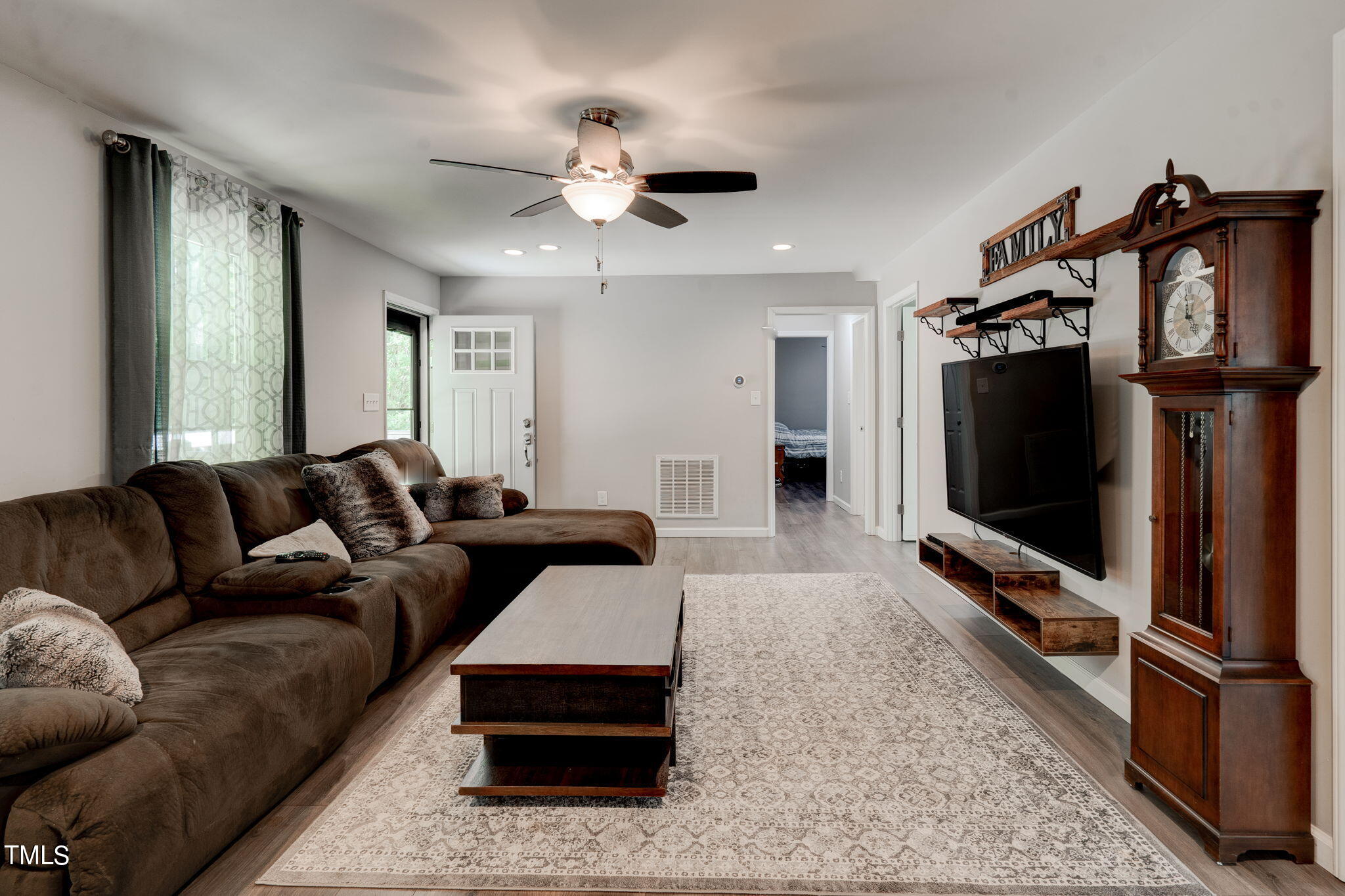 3408 High Gate Road Raleigh, NC 27603 - Photo 15 of 49 a living room with furniture and a flat screen tv