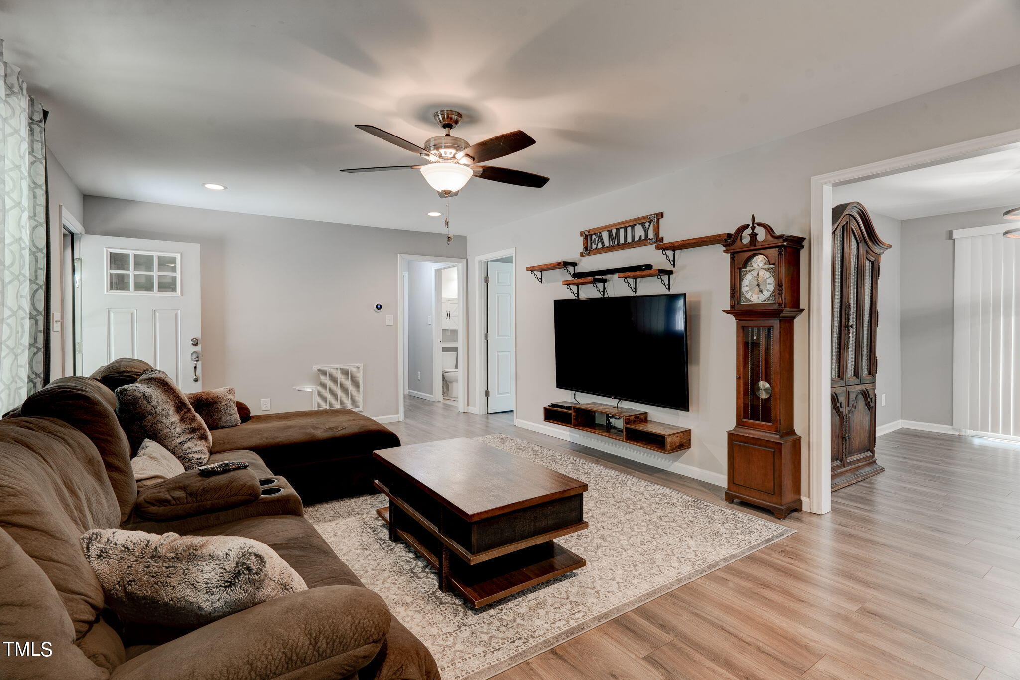 3408 High Gate Road Raleigh, NC 27603 - Photo 16 of 49 a living room with furniture and a flat screen tv
