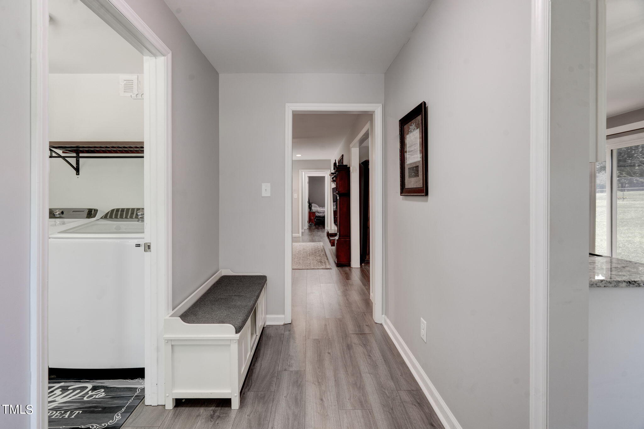 3408 High Gate Road Raleigh, NC 27603 - Photo 23 of 49 a hallway with wooden floor windows and stairs