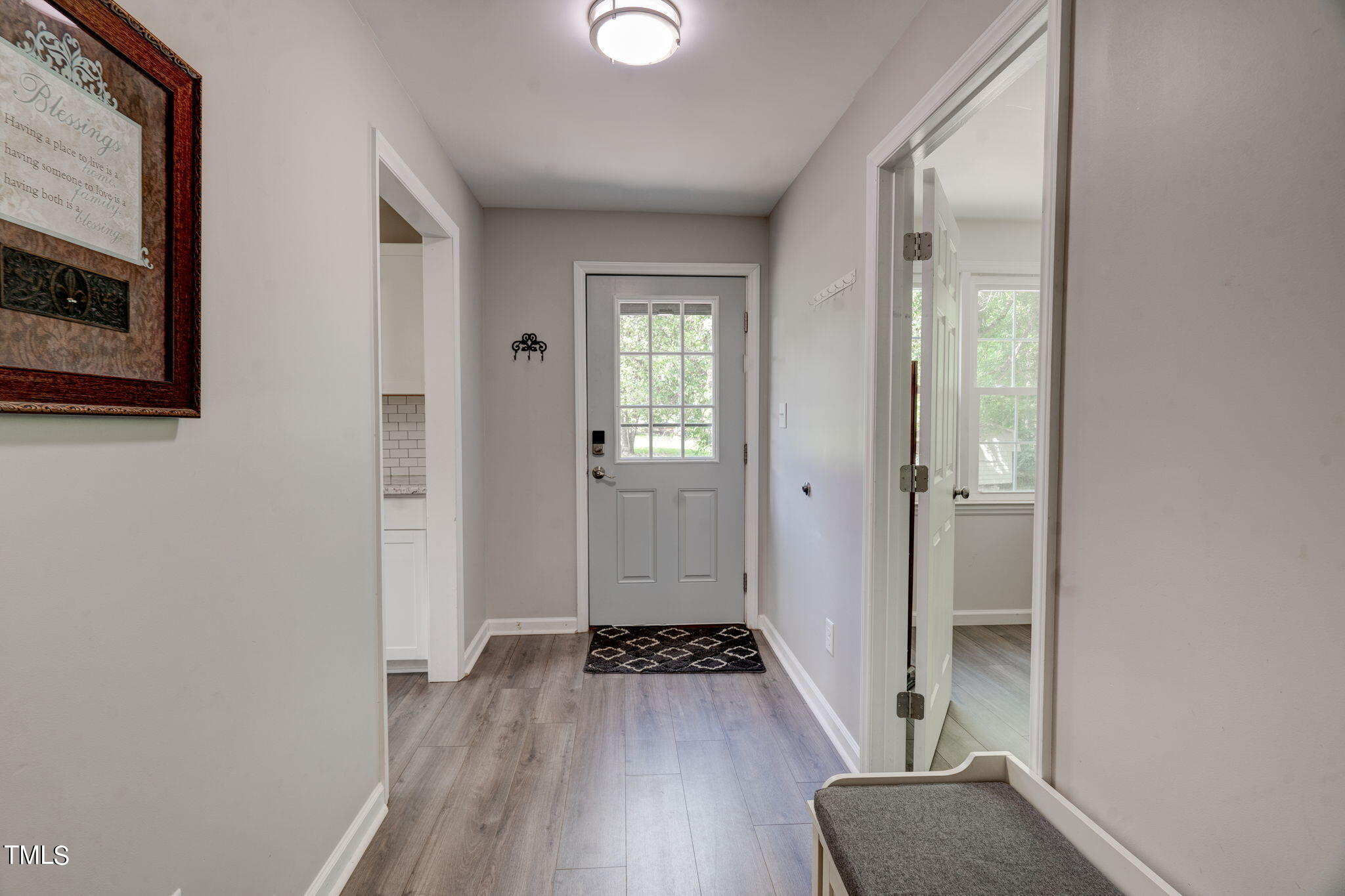 3408 High Gate Road Raleigh, NC 27603 - Photo 24 of 49 a view of a hallway with wooden floor and staircase