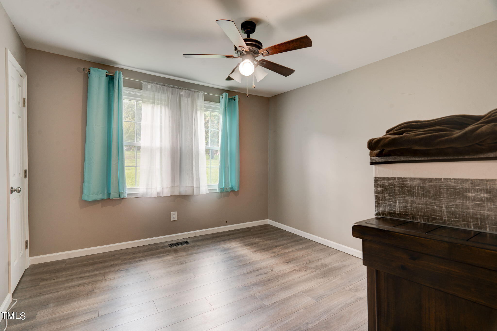 3408 High Gate Road Raleigh, NC 27603 - Photo 27 of 49 a view of wooden floor and a chandelier fan in a room