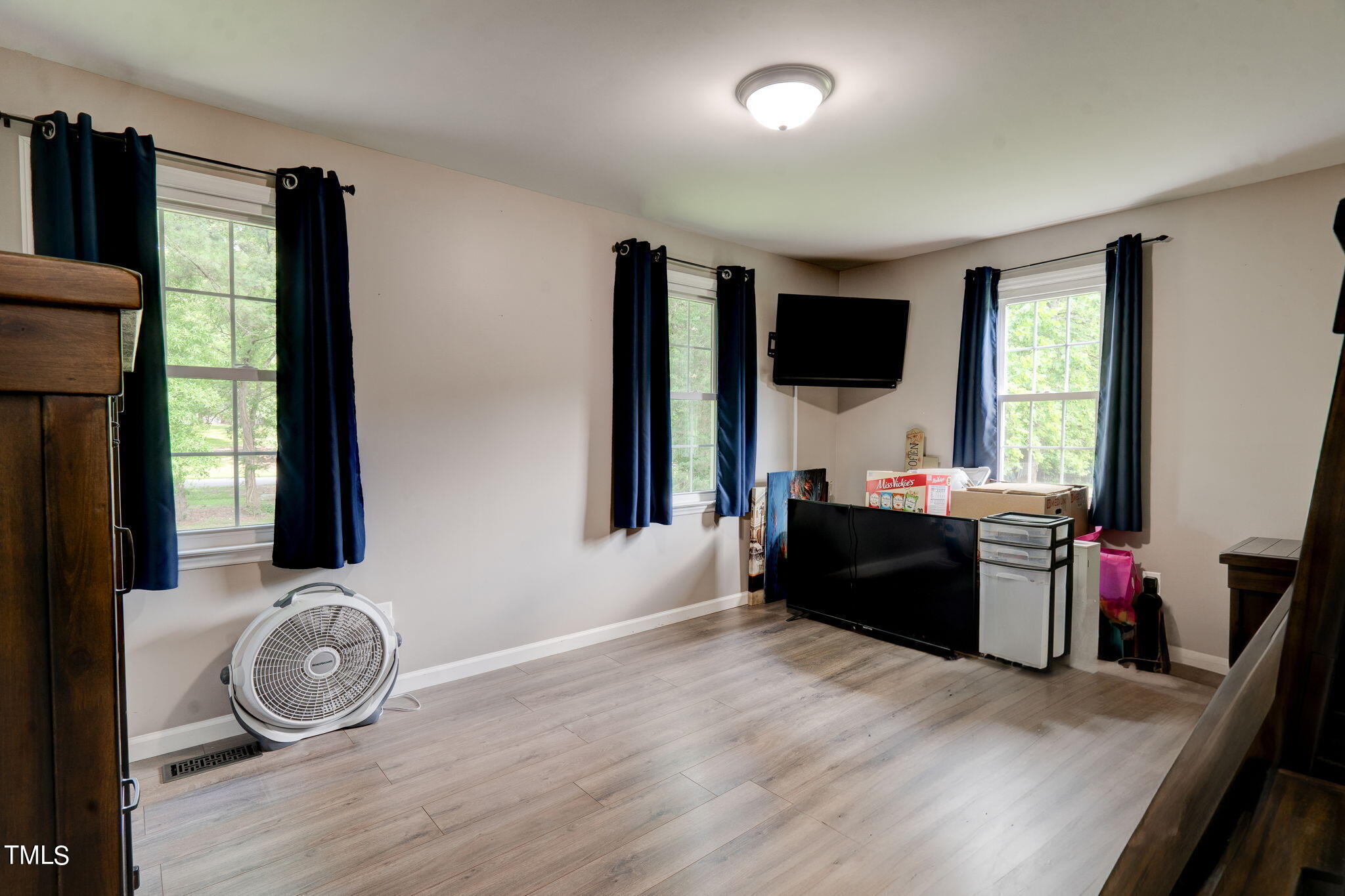 3408 High Gate Road Raleigh, NC 27603 - Photo 28 of 49 a living room with furniture and a flat screen tv