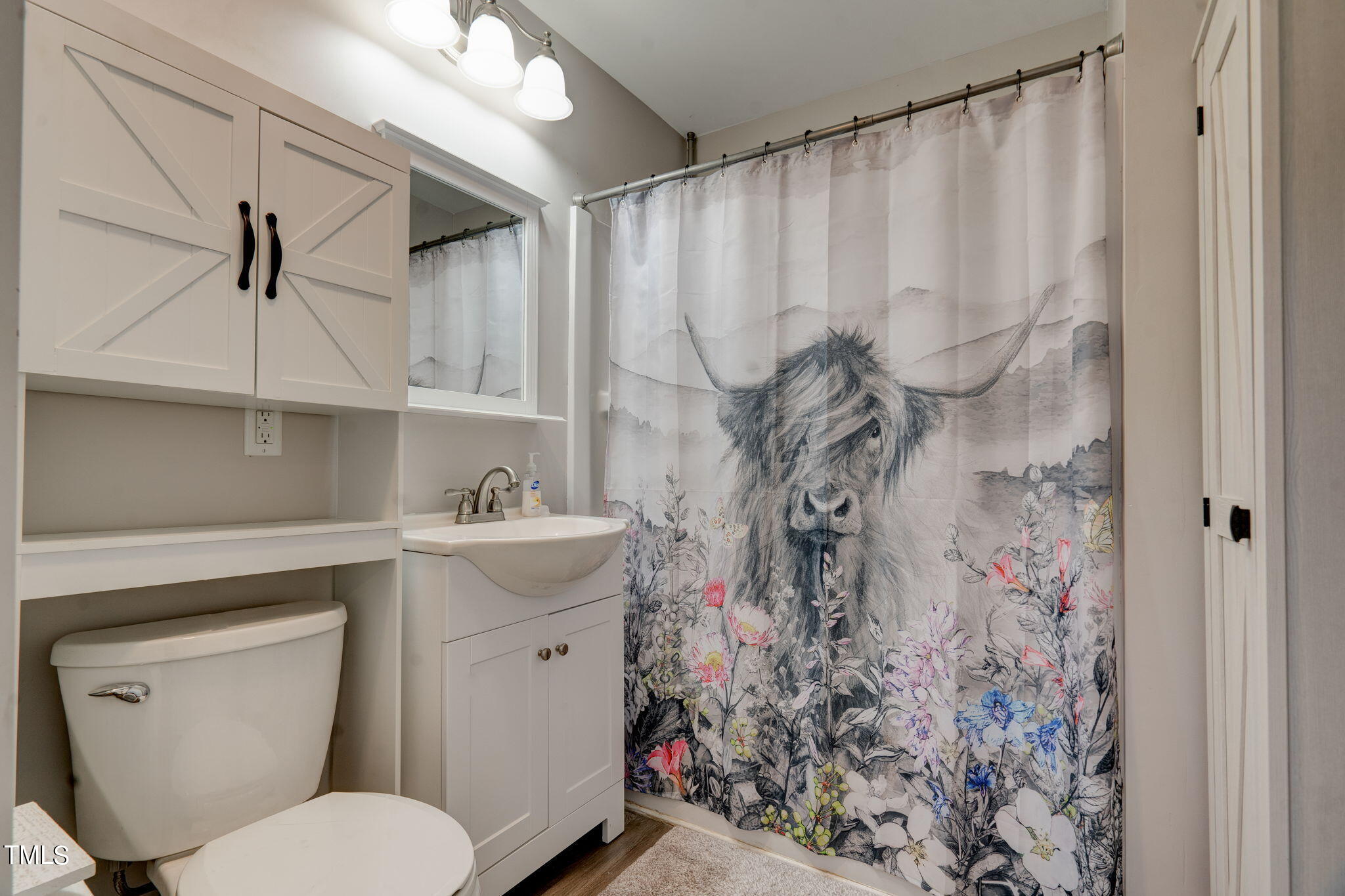 3408 High Gate Road Raleigh, NC 27603 - Photo 29 of 49 a bathroom with a sink toilet and shower