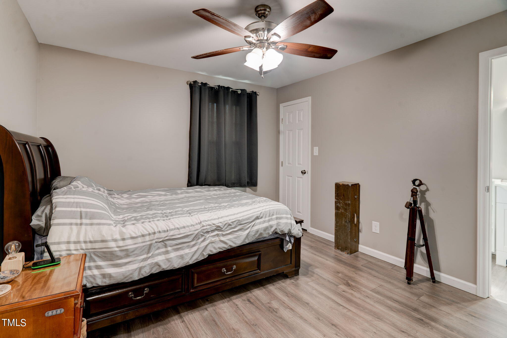 3408 High Gate Road Raleigh, NC 27603 - Photo 30 of 49 a spacious bedroom with a bed and a ceiling fan