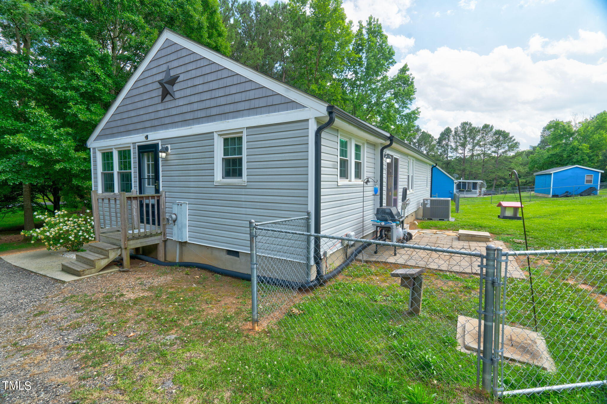 3408 High Gate Road Raleigh, NC 27603 - Photo 33 of 49 a backyard of a house with seating space