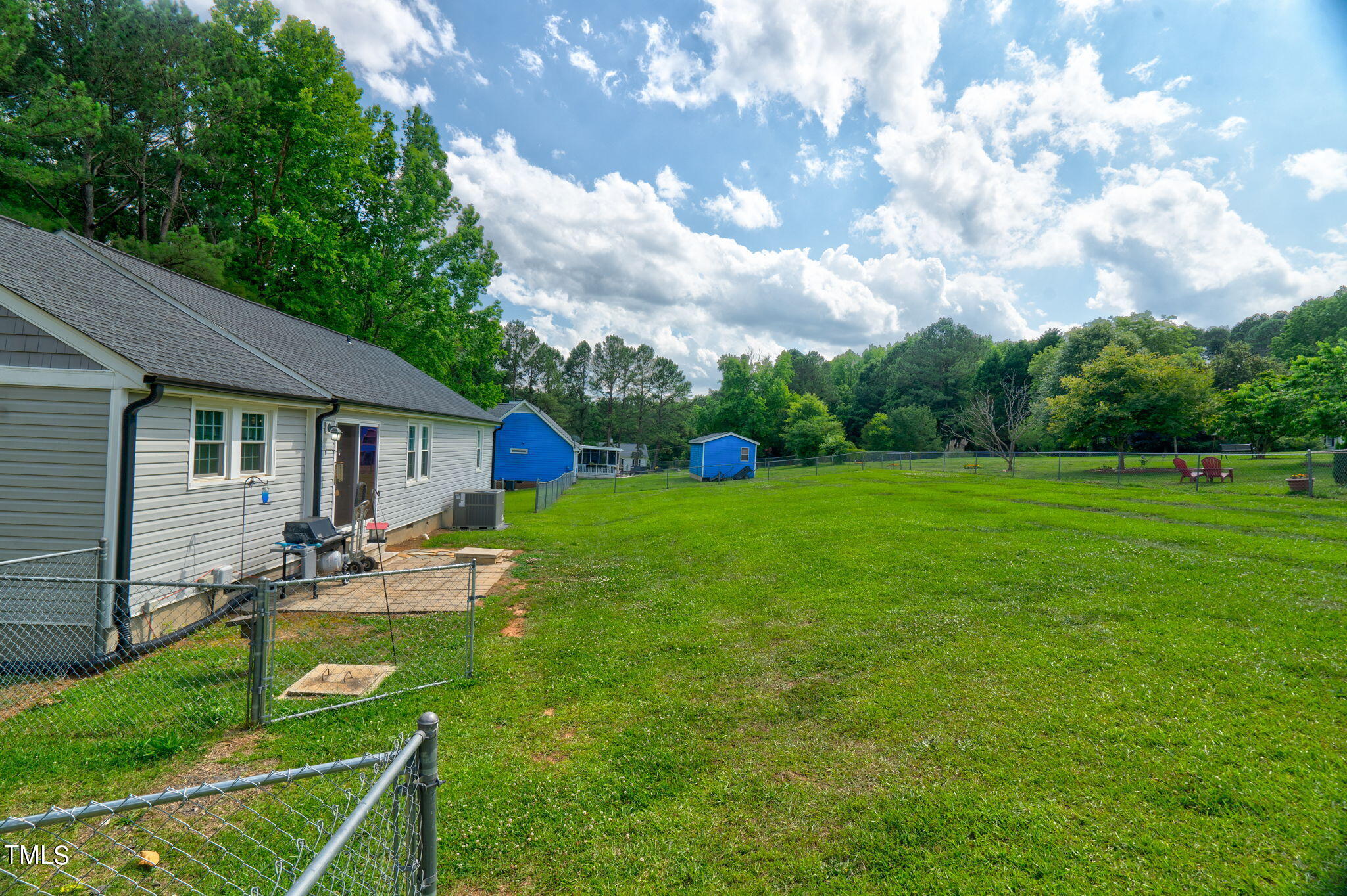 3408 High Gate Road Raleigh, NC 27603 - Photo 34 of 49 a view of a house with backyard sitting area and garden