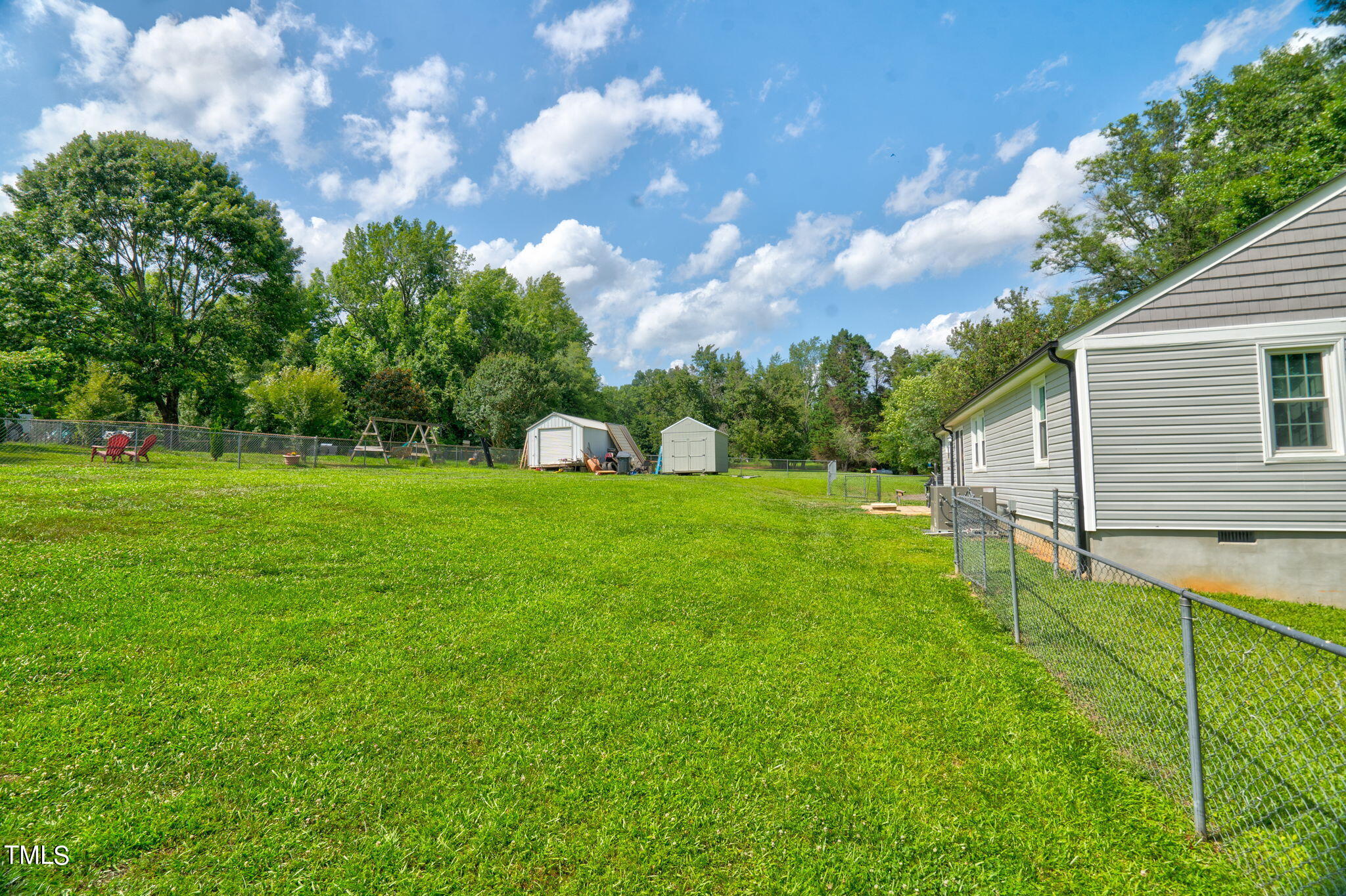 3408 High Gate Road Raleigh, NC 27603 - Photo 37 of 49 a view of an house with backyard space and garden
