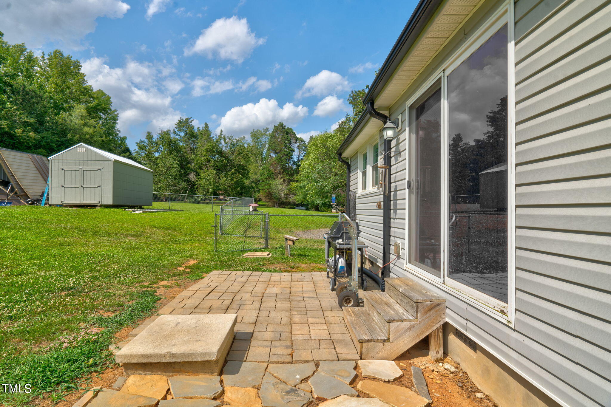 3408 High Gate Road Raleigh, NC 27603 - Photo 43 of 49 a view of backyard with sitting area