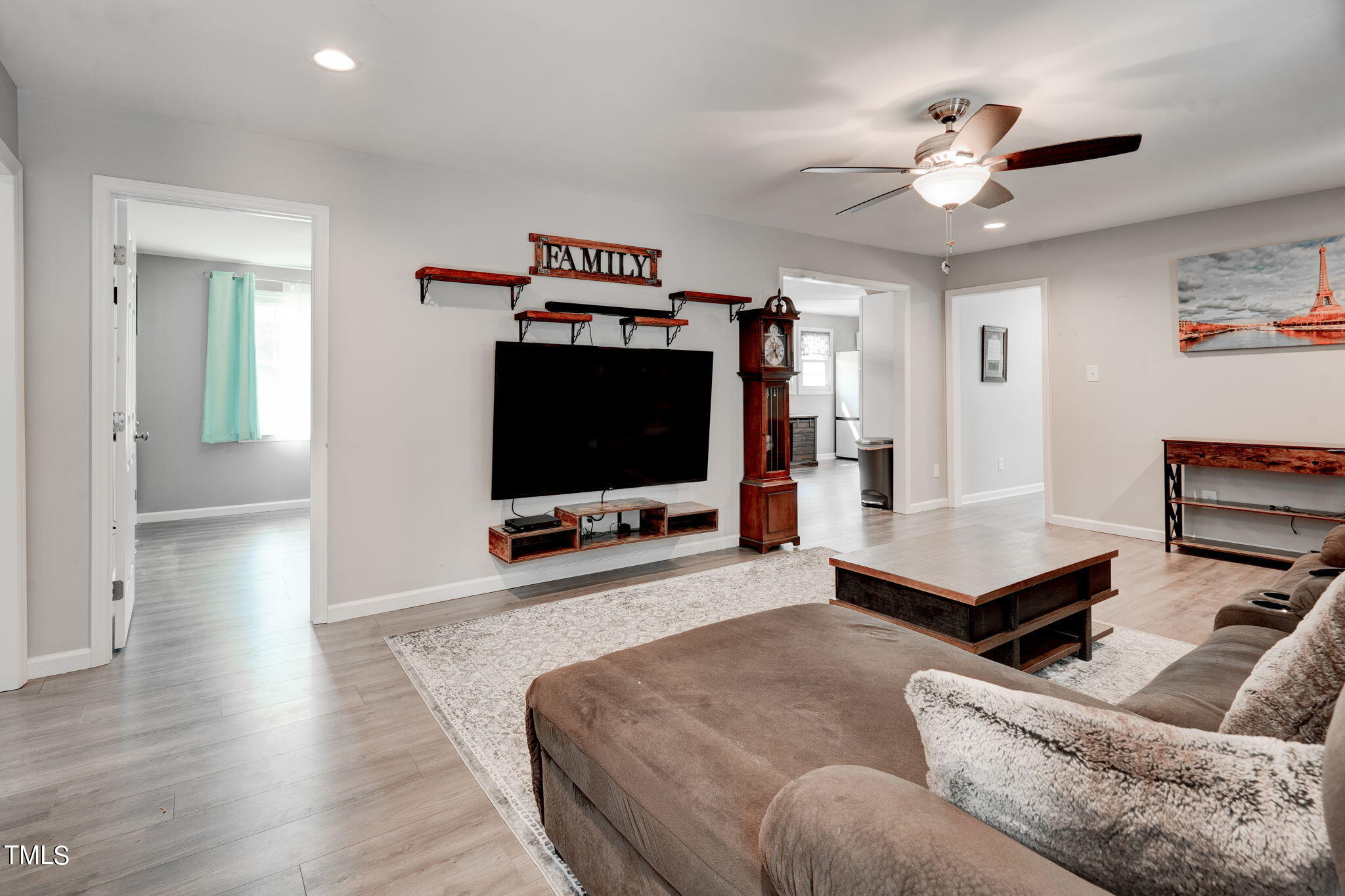 3408 High Gate Road Raleigh, NC 27603 - Photo 10 of 49 a living room with furniture and a flat screen tv