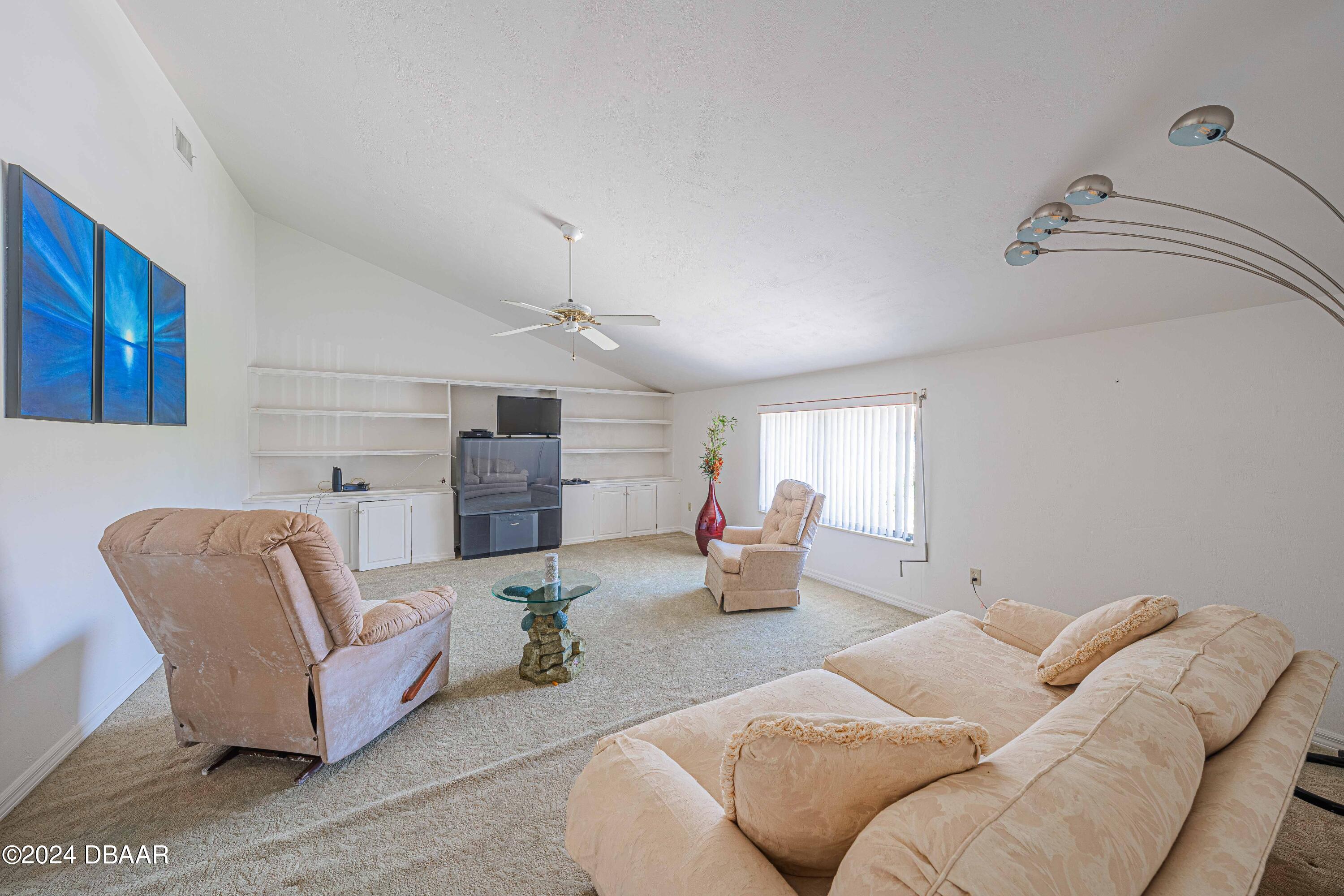 42 Jana Drive Ponce Inlet, FL 32127 - Photo 7 of 34 a living room with furniture and view of room