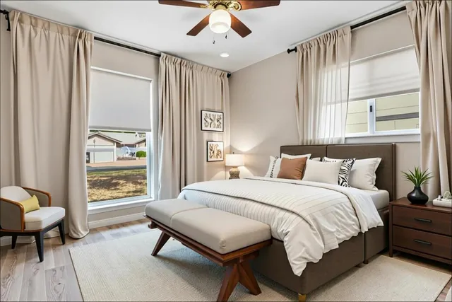 a bedroom with a bed and a window