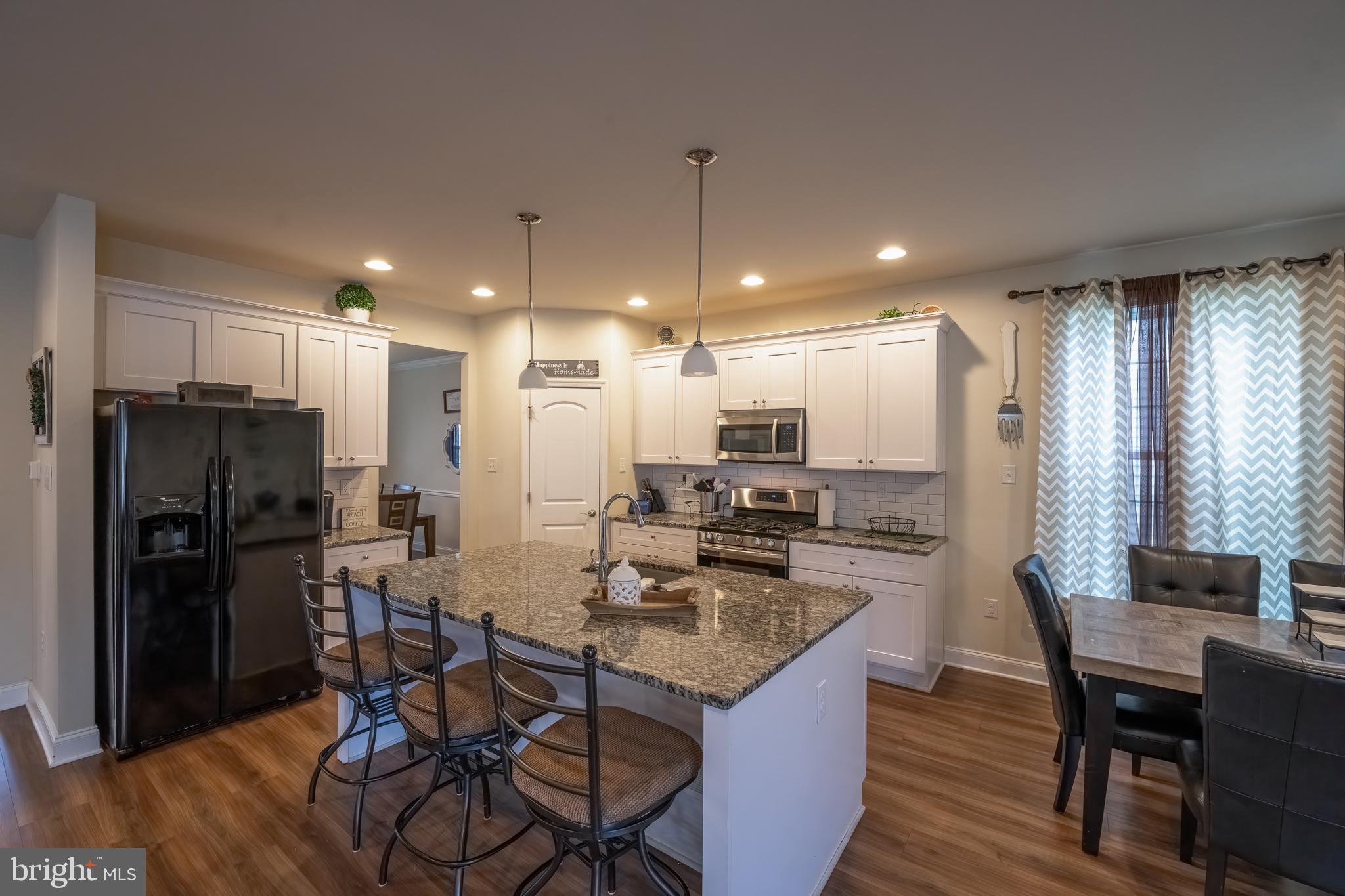 Spacious Island with Granite Counter Top