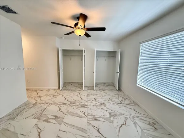 a view of an empty room with a window