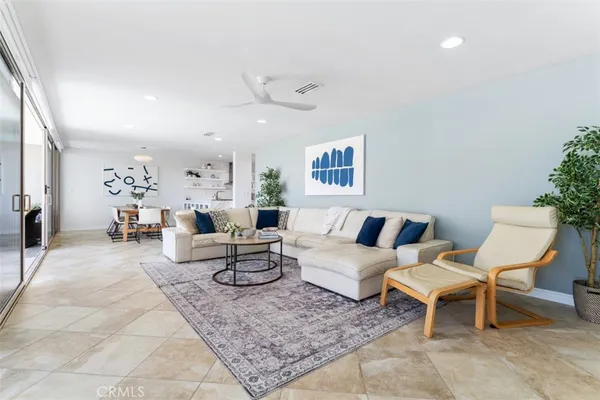 a living room with furniture and a rug