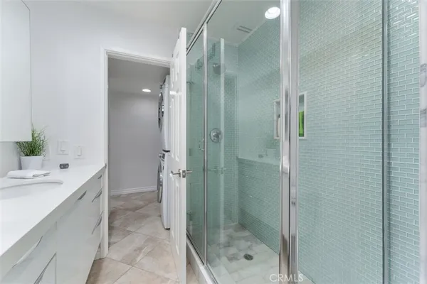 a bathroom with a shower and a sink