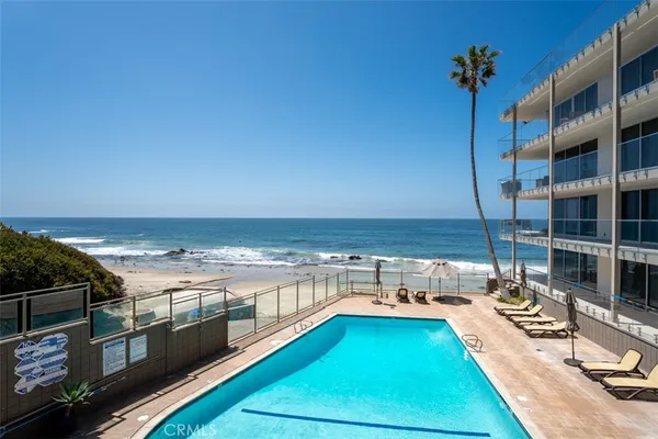 a view of a swimming pool with an ocean view