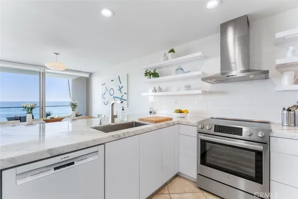 a kitchen with cabinets a sink and appliances