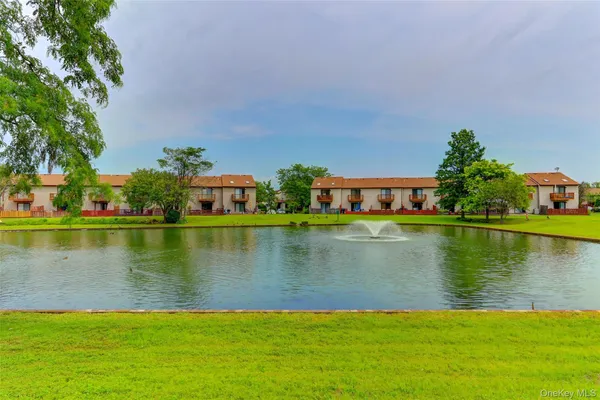 a view of building with lake view and a mountain view