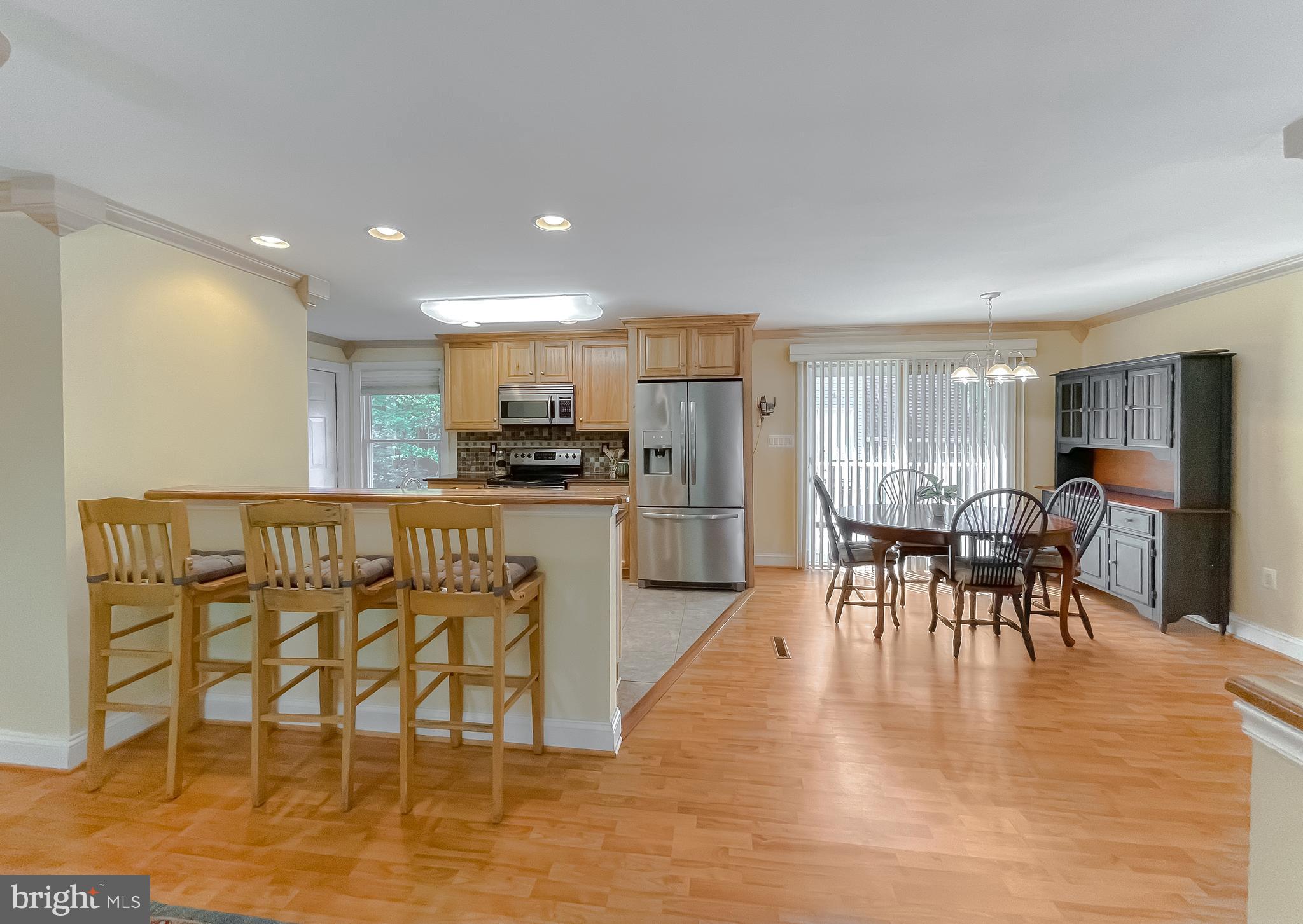 239 Frontier Trail Lusby, MD 20657 - Photo 72 of 73 Open floor plan with seating and custom bar top
