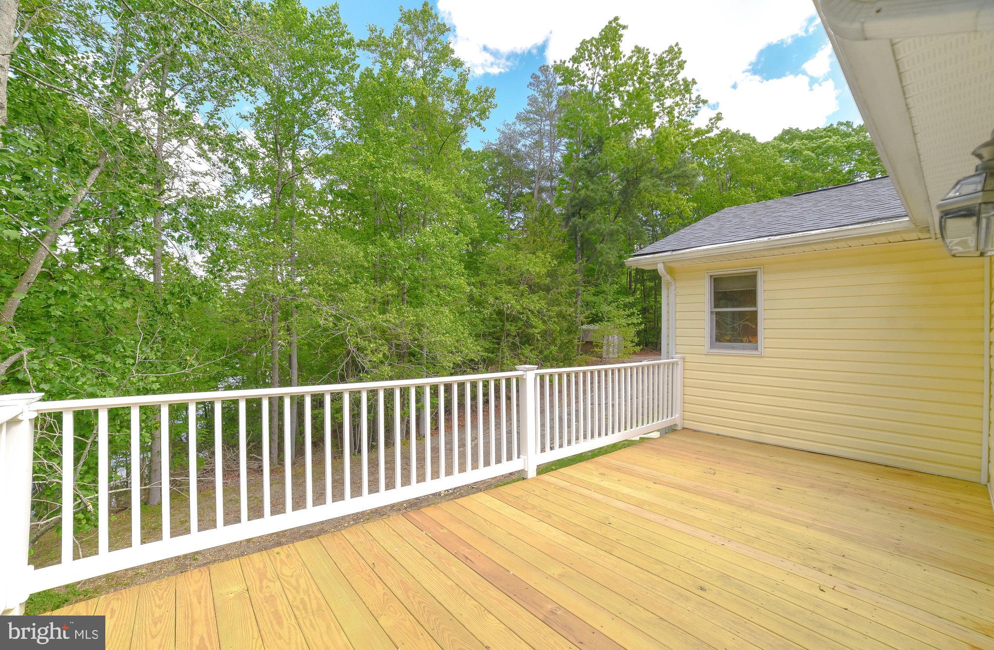 239 Frontier Trail Lusby, MD 20657 - Photo 28 of 73 Private side deck off of primary suite