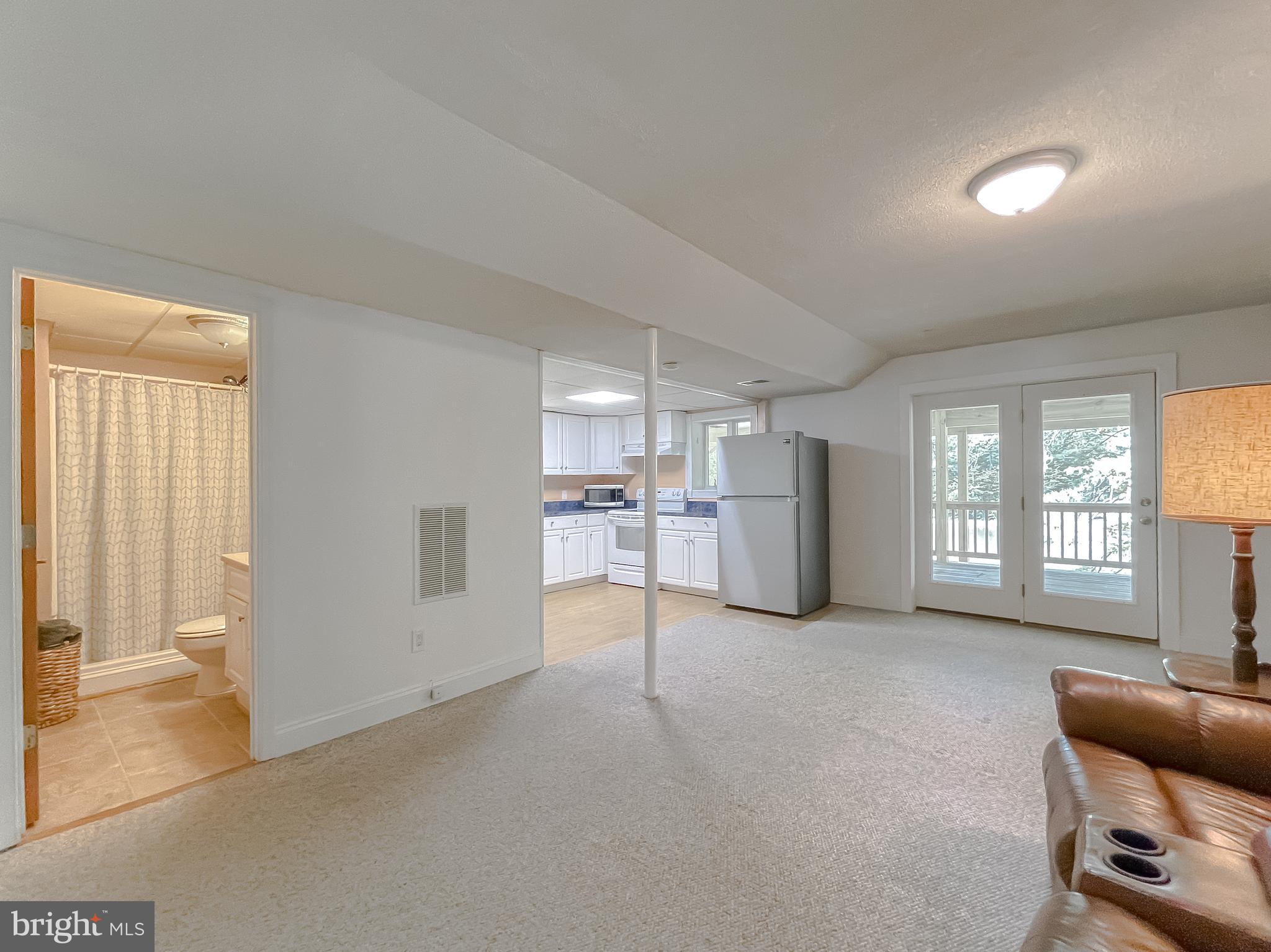 239 Frontier Trail Lusby, MD 20657 - Photo 35 of 73 Second living area with sliders to covered porch