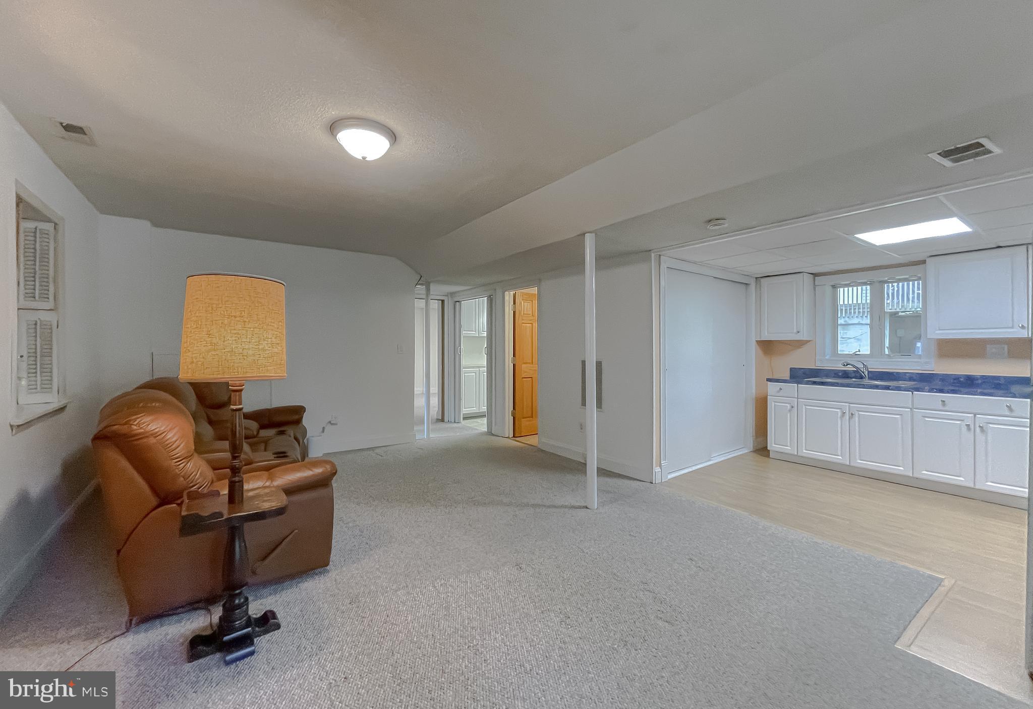 239 Frontier Trail Lusby, MD 20657 - Photo 36 of 73 Spacious second living room and kitchen area