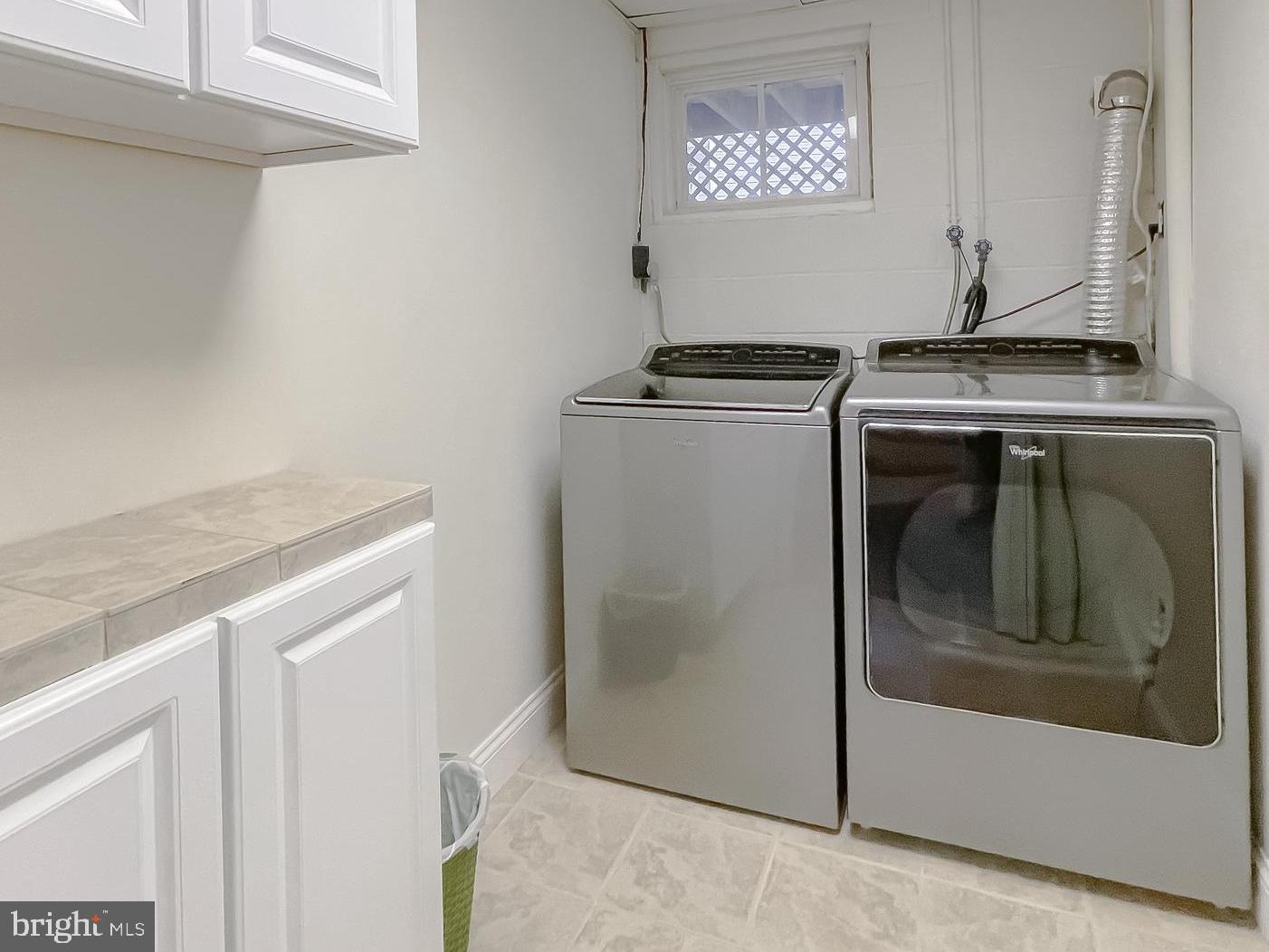 239 Frontier Trail Lusby, MD 20657 - Photo 48 of 73 Laundry with extra floorspace and cabinets