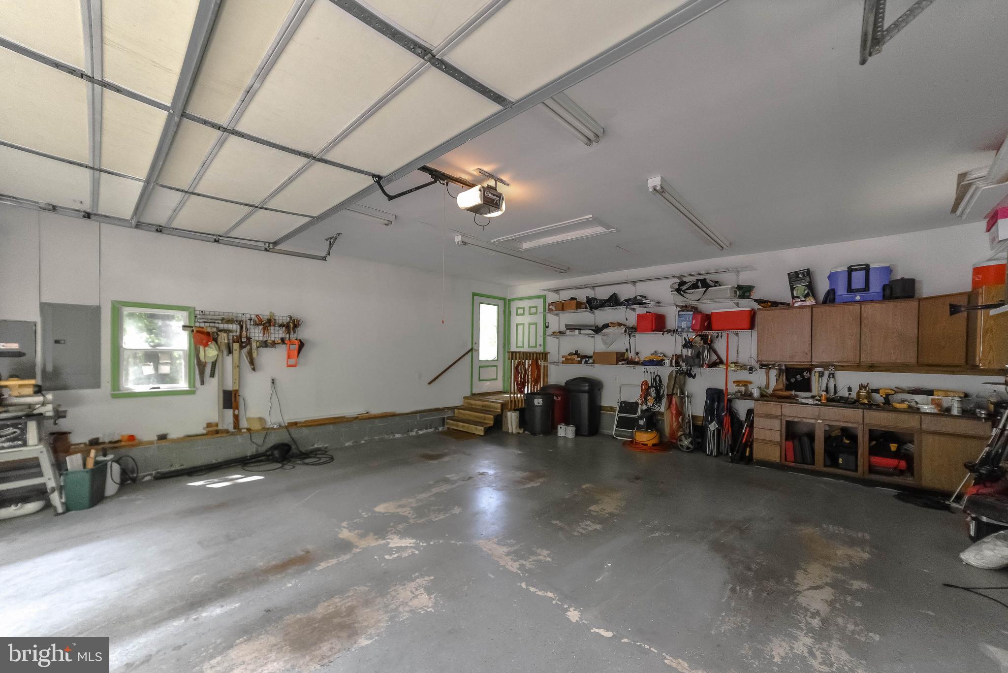 239 Frontier Trail Lusby, MD 20657 - Photo 53 of 73 2-car garage with storage & extra electric panel