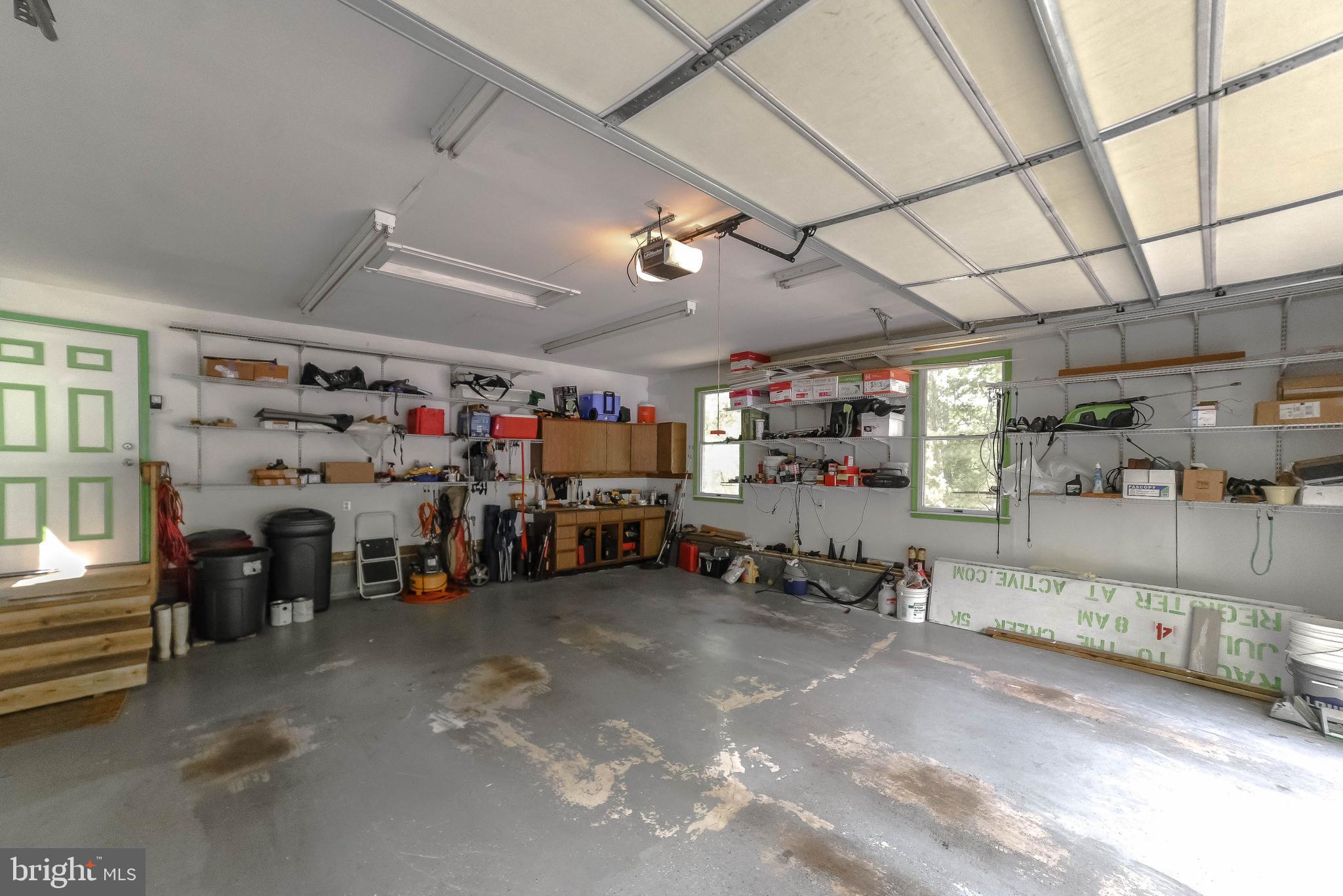 239 Frontier Trail Lusby, MD 20657 - Photo 54 of 73 Work bench and extra shelving in garage