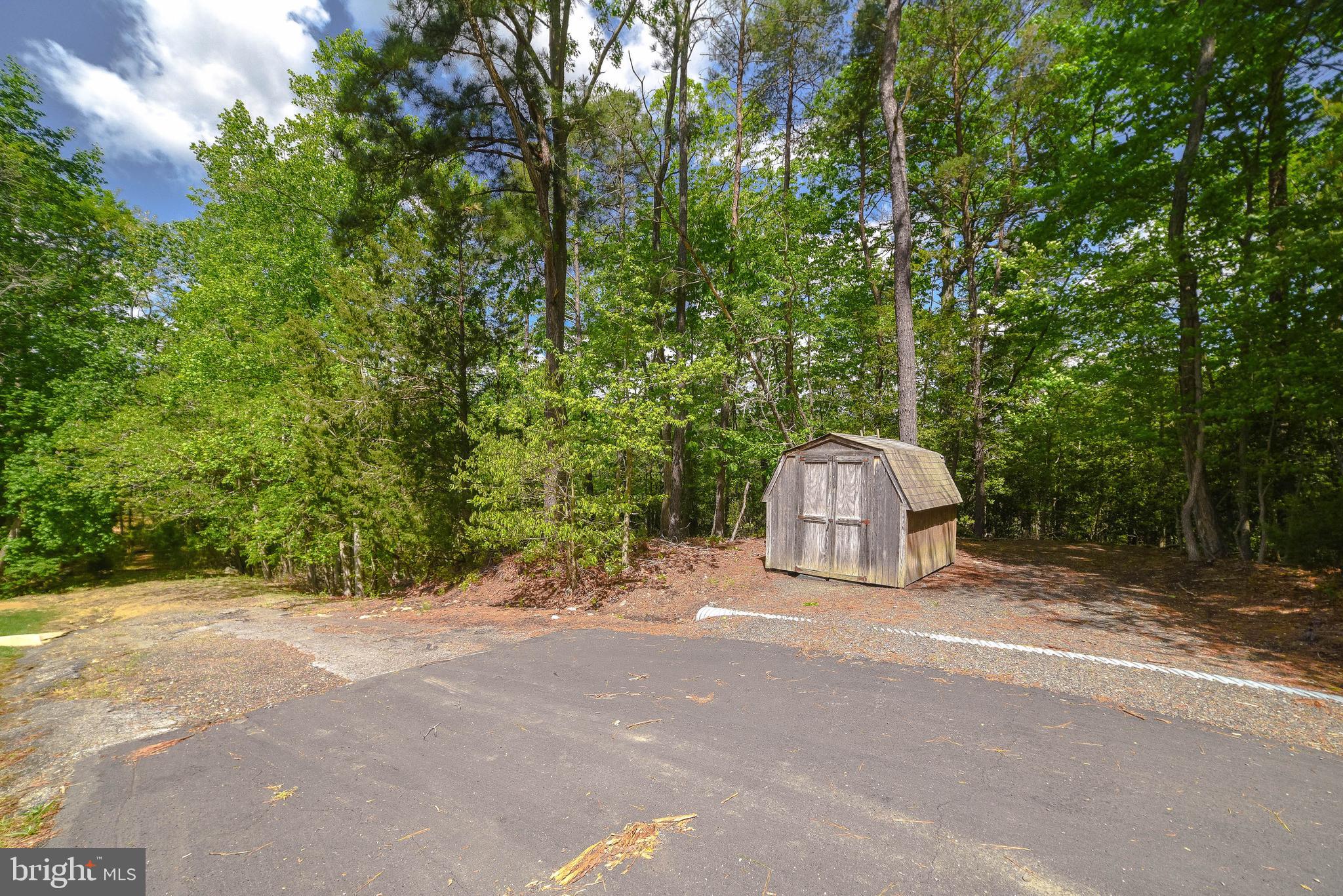 239 Frontier Trail Lusby, MD 20657 - Photo 56 of 73 Adjacent waterfront lot includes shed