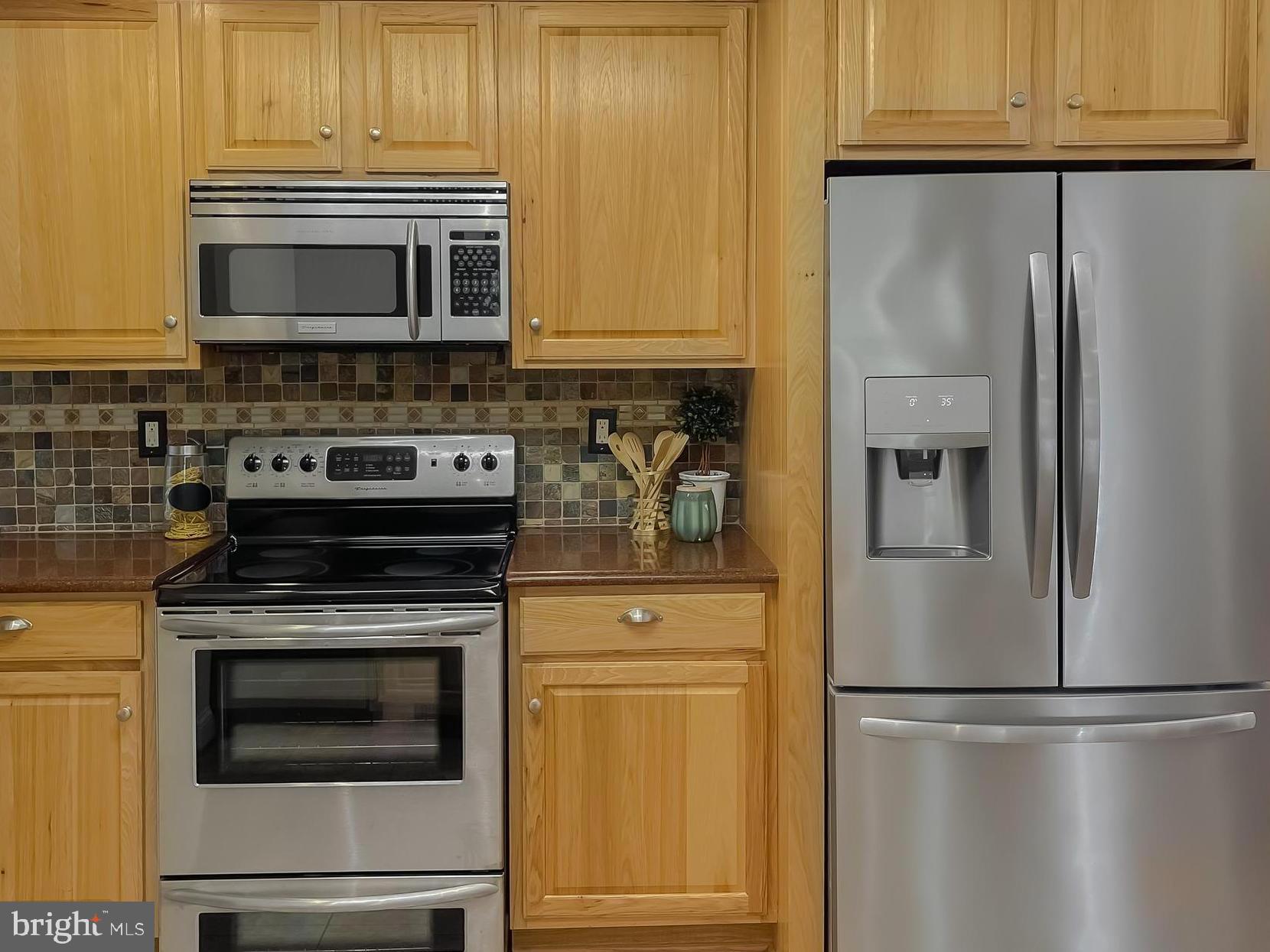 239 Frontier Trail Lusby, MD 20657 - Photo 8 of 73 Kitchen has hickory cabinets & like-new appliances