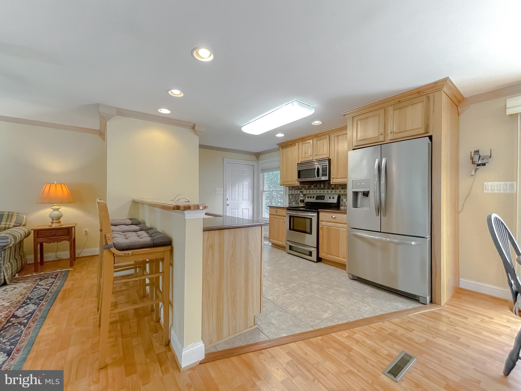 239 Frontier Trail Lusby, MD 20657 - Photo 9 of 73 Kitchen has direct access to 2-car garage