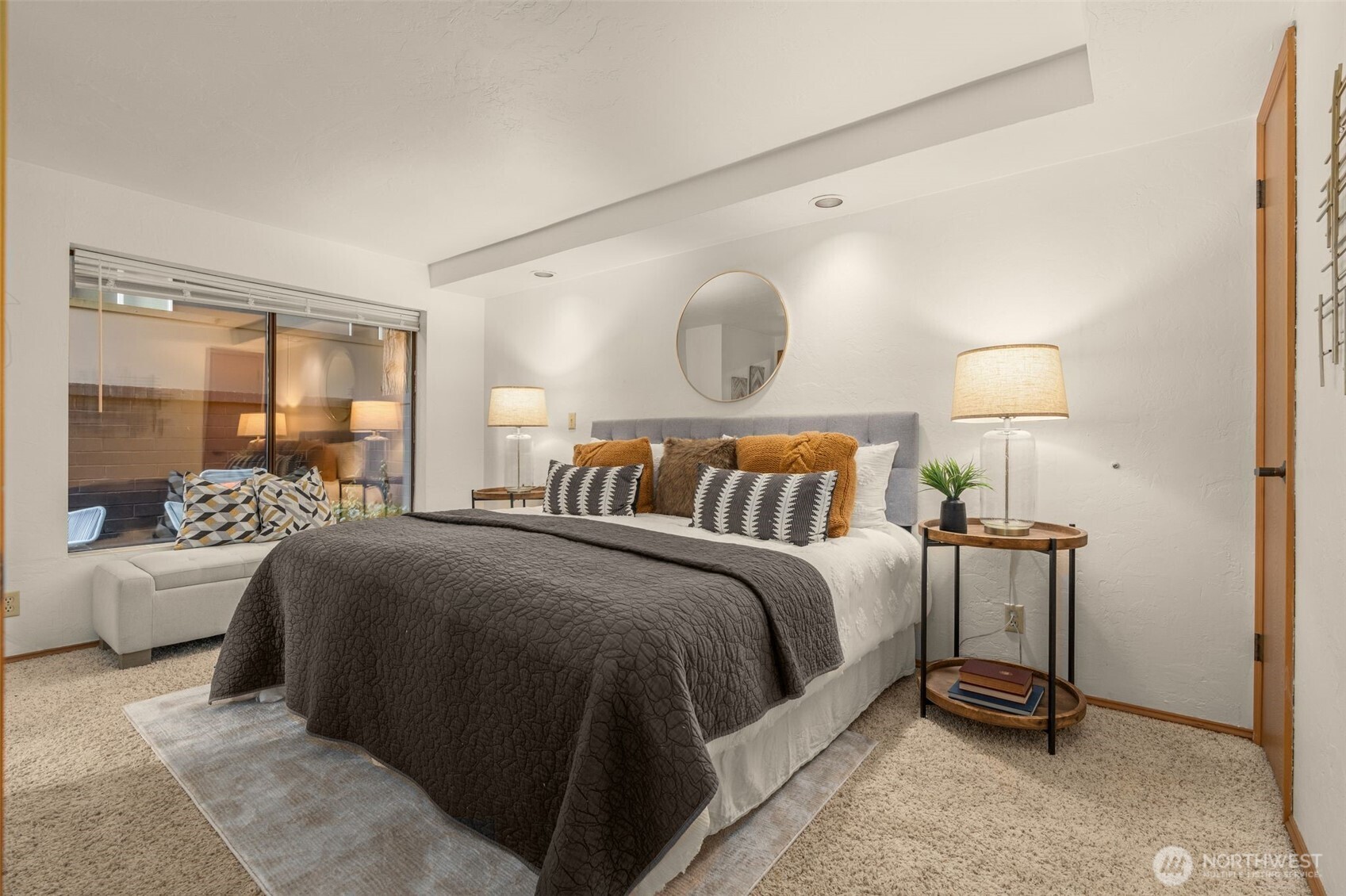 1627 California Avenue Southwest, Unit 1 Seattle, WA 98116 - Photo 11 of 24 a bedroom with a bed and wooden floor