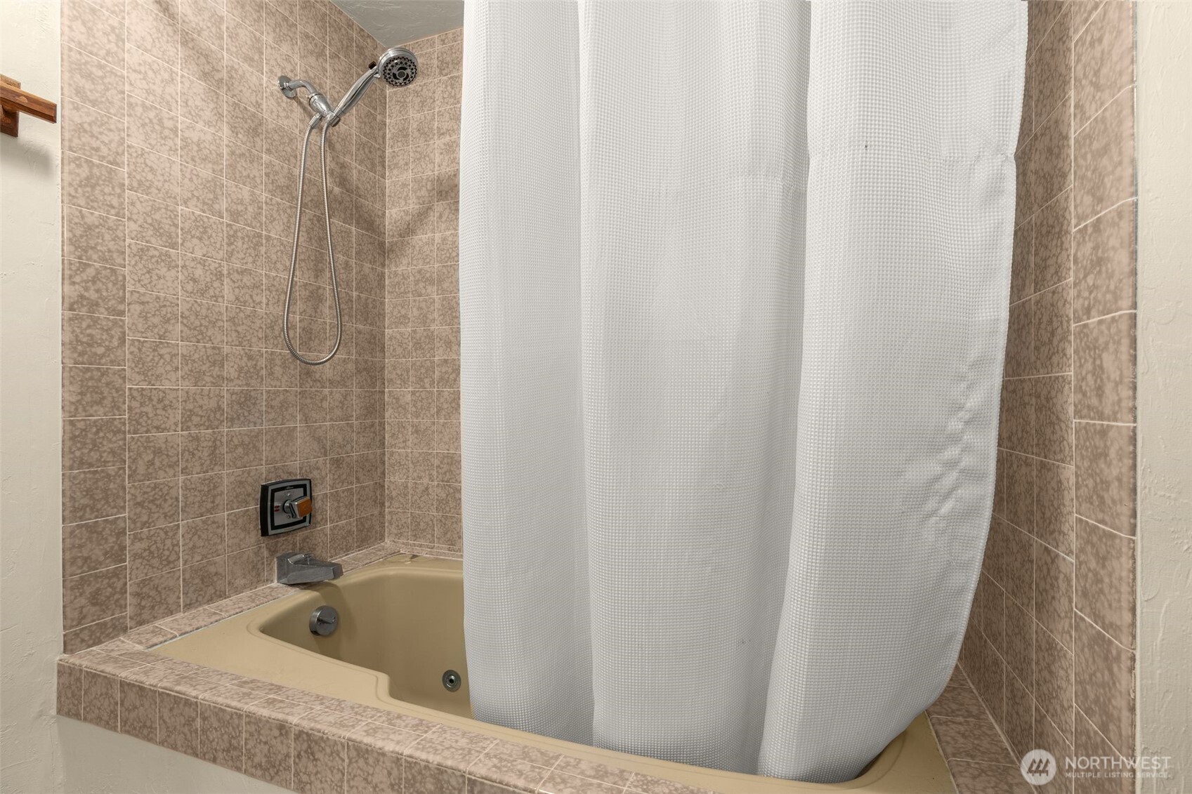 1627 California Avenue Southwest, Unit 1 Seattle, WA 98116 - Photo 17 of 24 a bathroom with a bathtub and shower