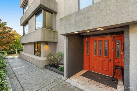 a view of backyard of house and trees