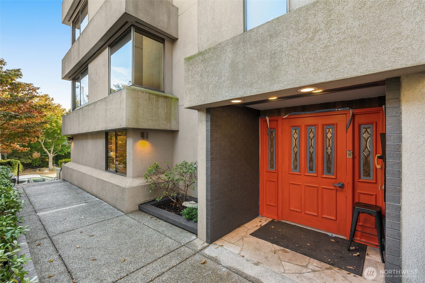 1627 California Avenue Southwest, Unit 1 Seattle, WA 98116 - Photo 2 of 24 a view of backyard of house and trees