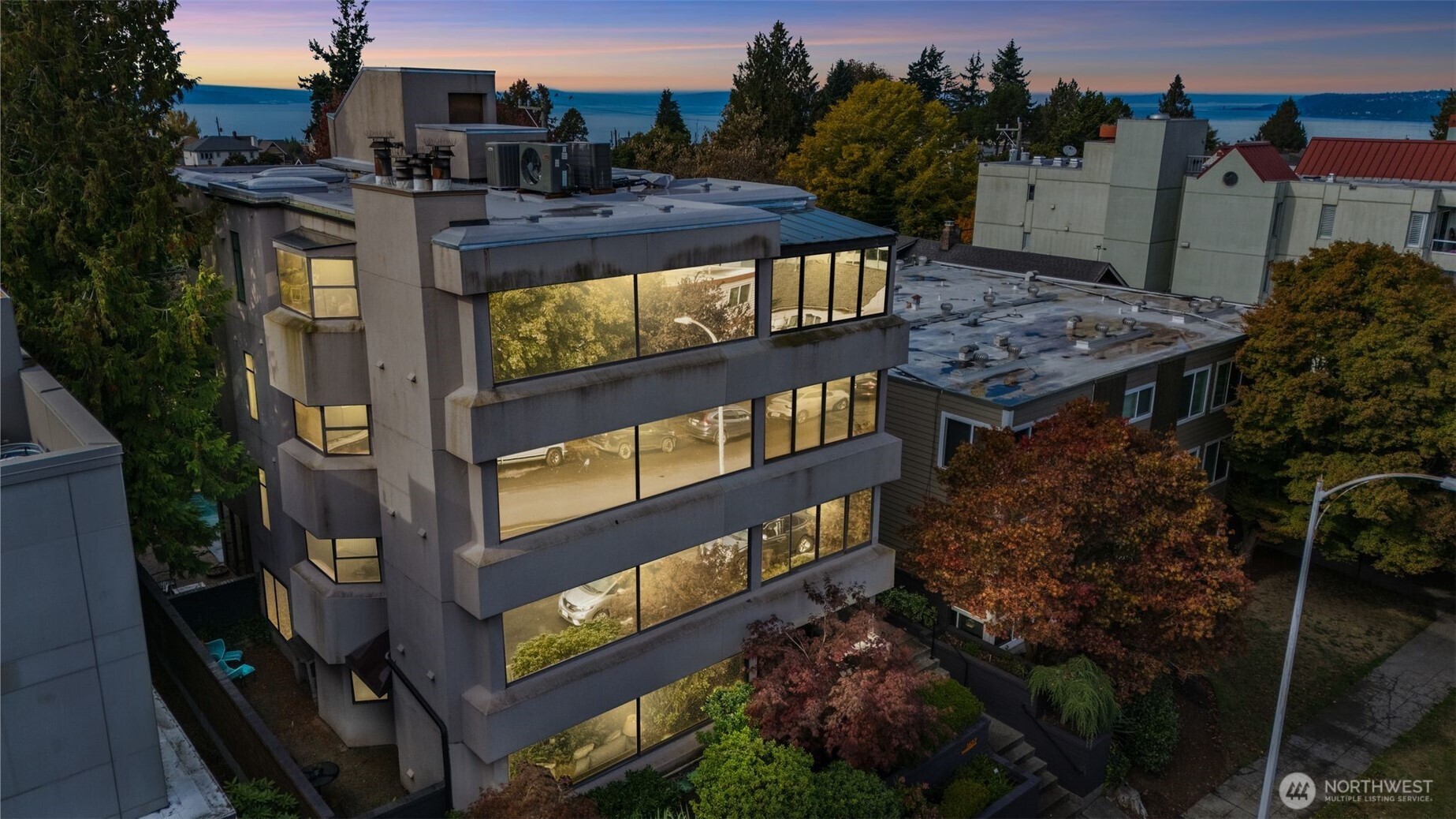 1627 California Avenue Southwest, Unit 1 Seattle, WA 98116 - Photo 23 of 24 a view of a balcony with chairs and iron fence